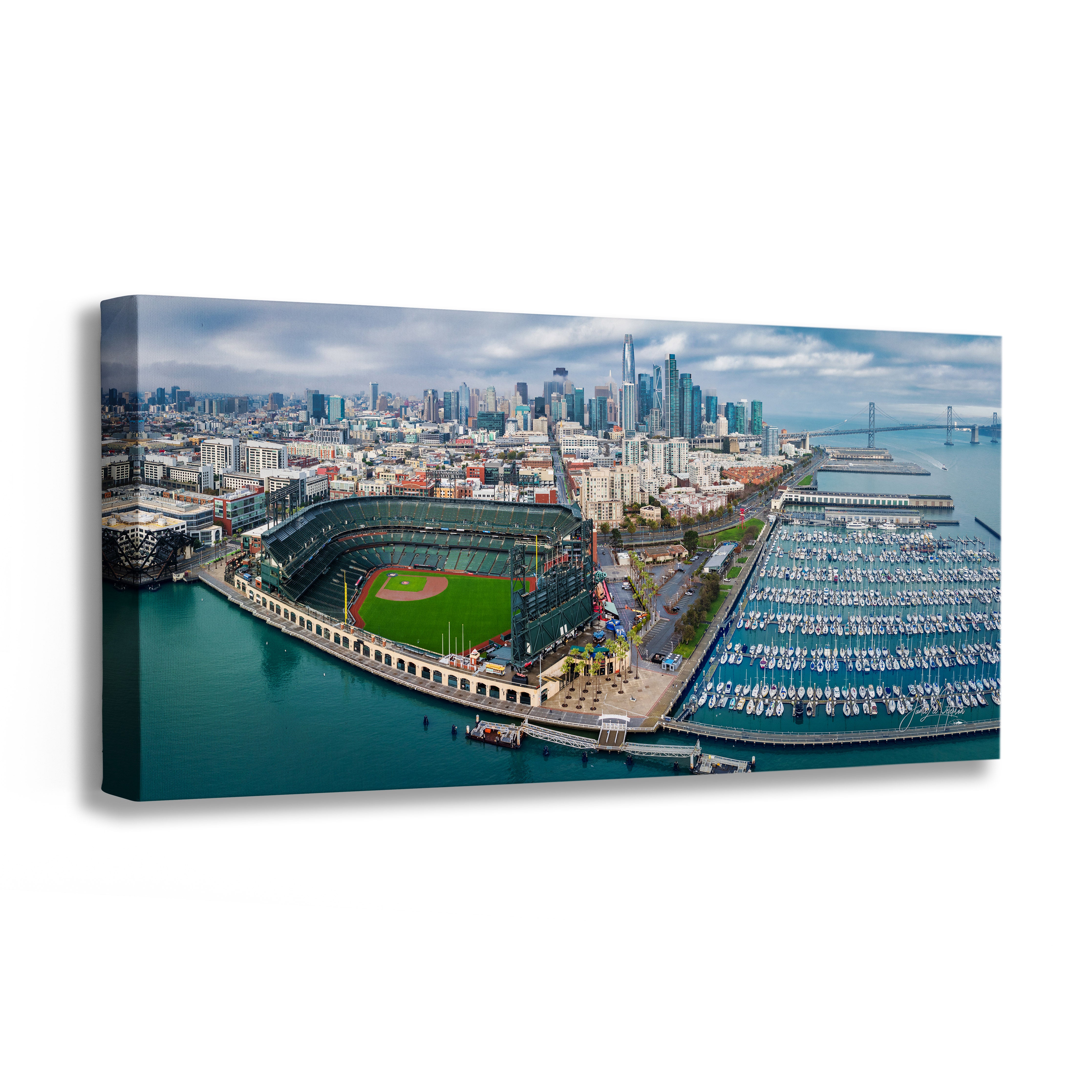 An Oracle Park Skyline Panorama wall art print showing an aerial view of San Francisco, featuring the city skyline, Bay Bridge, waterfront, and a baseball stadium, displayed against a plain white background.