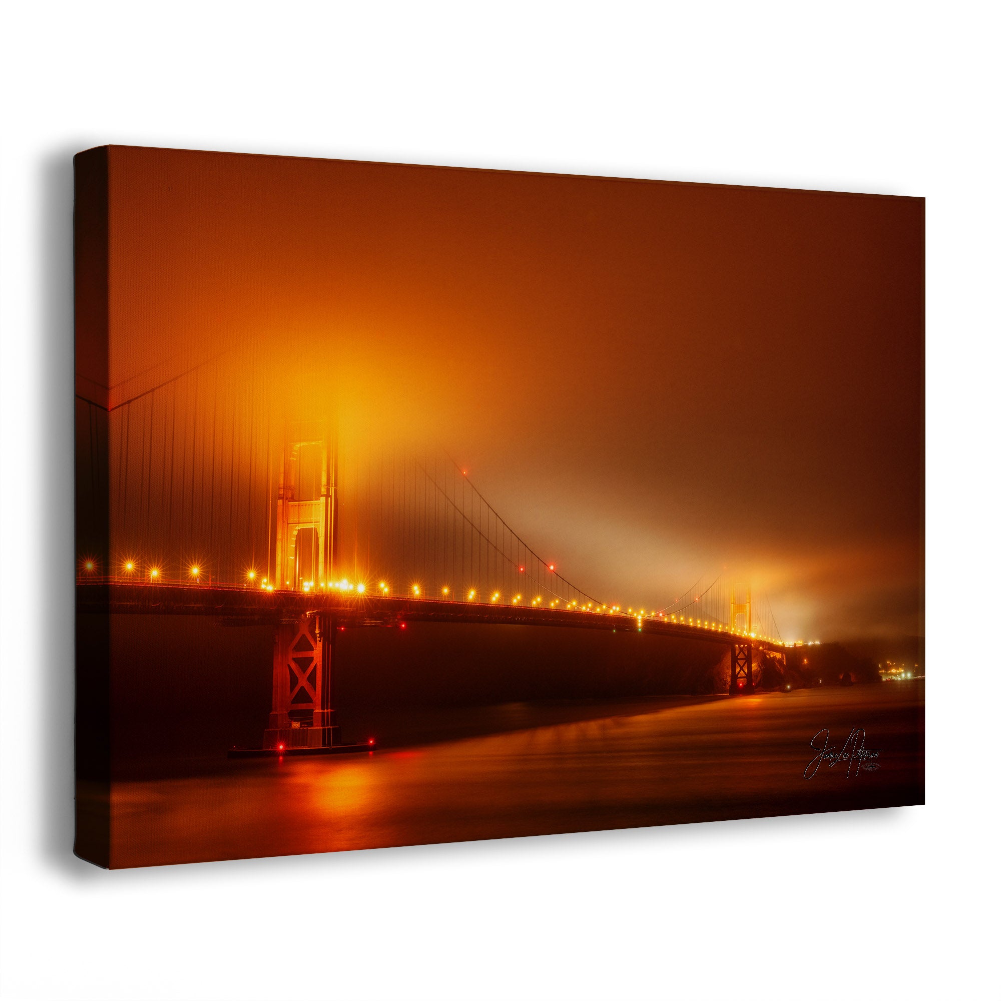 Canvas print of the Golden Gate Bridge at night with warm orange and yellow tones.