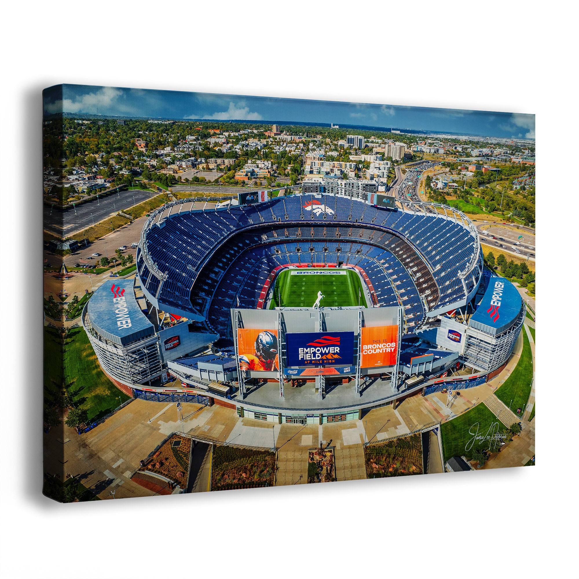 A Denver Broncos Stadium art print showing an aerial view of the Denver Broncos Mile High football stadium, photographed at an angle against a plain white background.