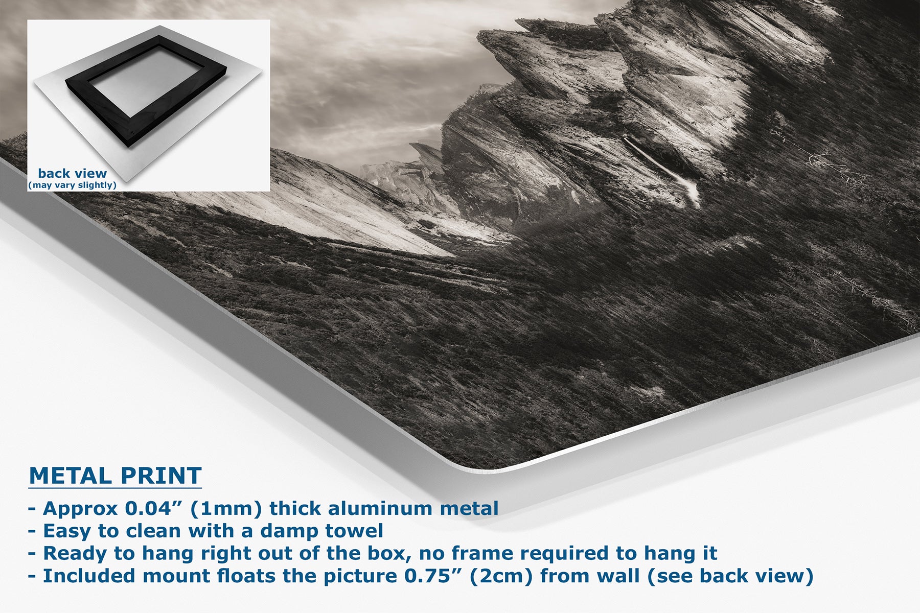 A large rectangular metal wall art print showing a black-and-white mountain landscape, displayed at an angle on a white background with product details and a small back-view inset. Text reads 'METAL PRINT' and describes the aluminum finish and mounting.