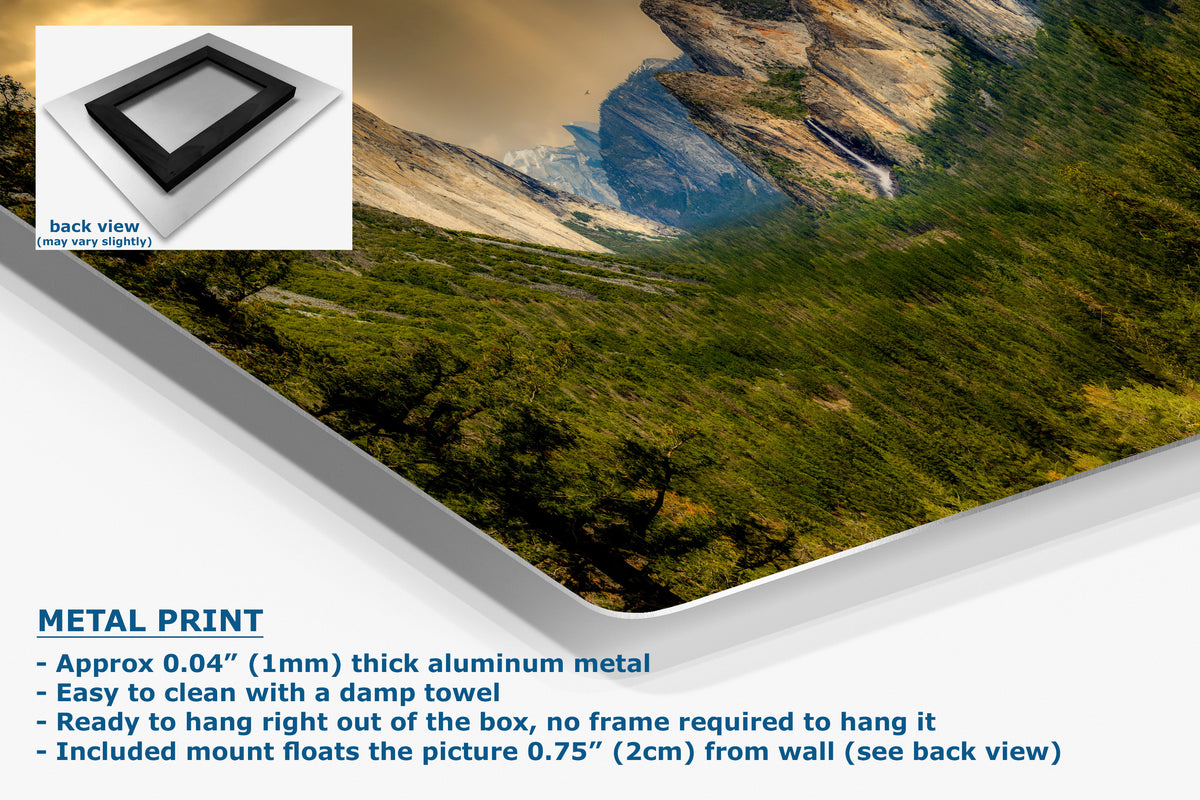 A metal wall art print showing a mountain landscape with green slopes and a blue river, presented at an angle with product text and a small back-view inset on a white background.