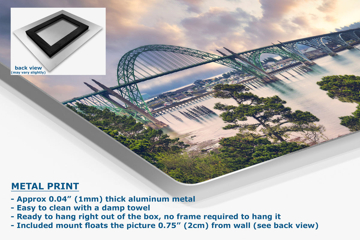 A large wall art print showing a scenic bridge over water with trees and a cloudy sky, presented at an angle with a small inset showing the back view of the frame mount. Text on the image reads 'METAL PRINT' and lists product details.