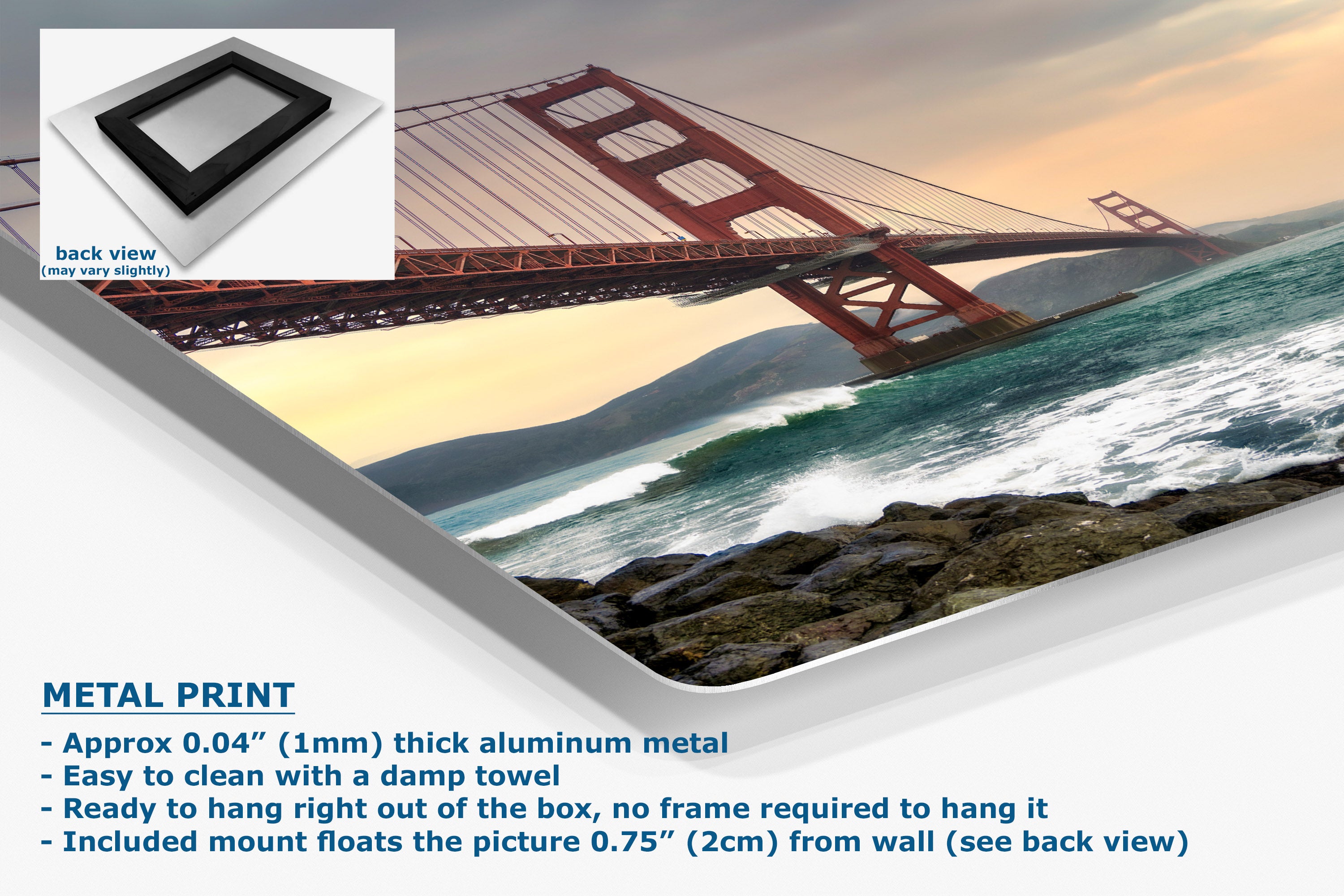 A metal wall art print showing a large red suspension bridge over ocean water at sunset, with a small inset showing the back view of the frame. Text on the image describes the product as a metal print with aluminum construction and mounting details.