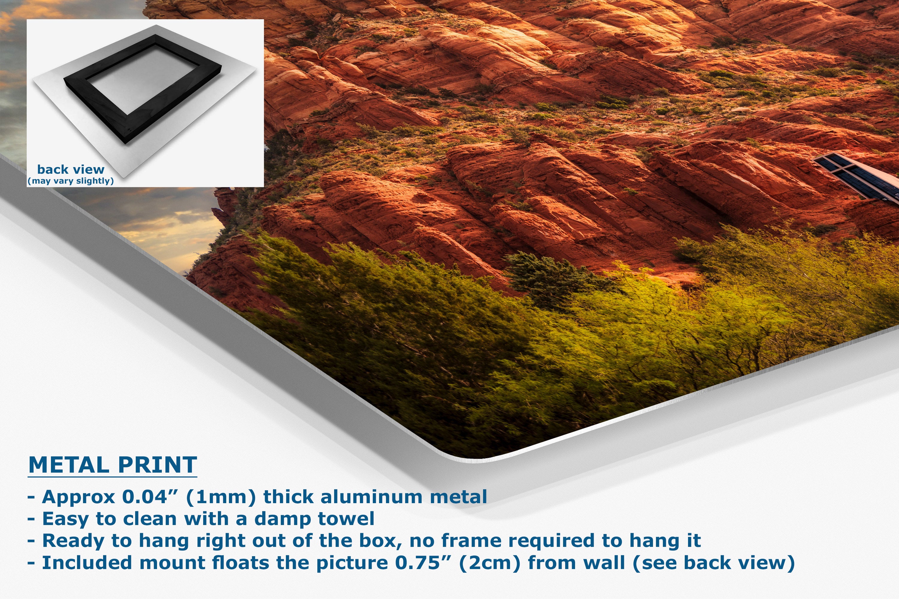 A corner view of an aluminum metal print panel displaying a landscape photo of red rock cliffs and green trees, shown at an angle with a white inset showing the back view of the frame. Text on the bottom left reads 'METAL PRINT' with product details.