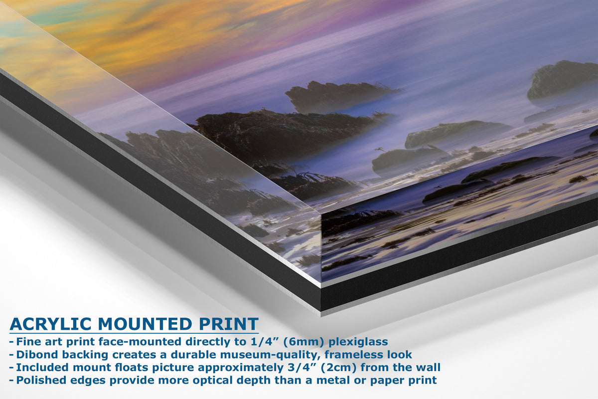 Acrylic mounted art print of a coastal landscape with a sunset sky, shown at an angle with product details and text on a white background.