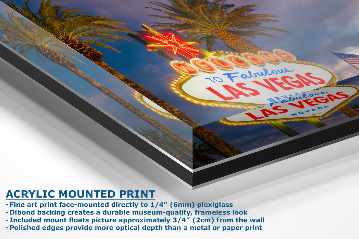 A corner view of an acrylic-mounted print of the Las Vegas sign, shown at an angle with descriptive text on a white background.