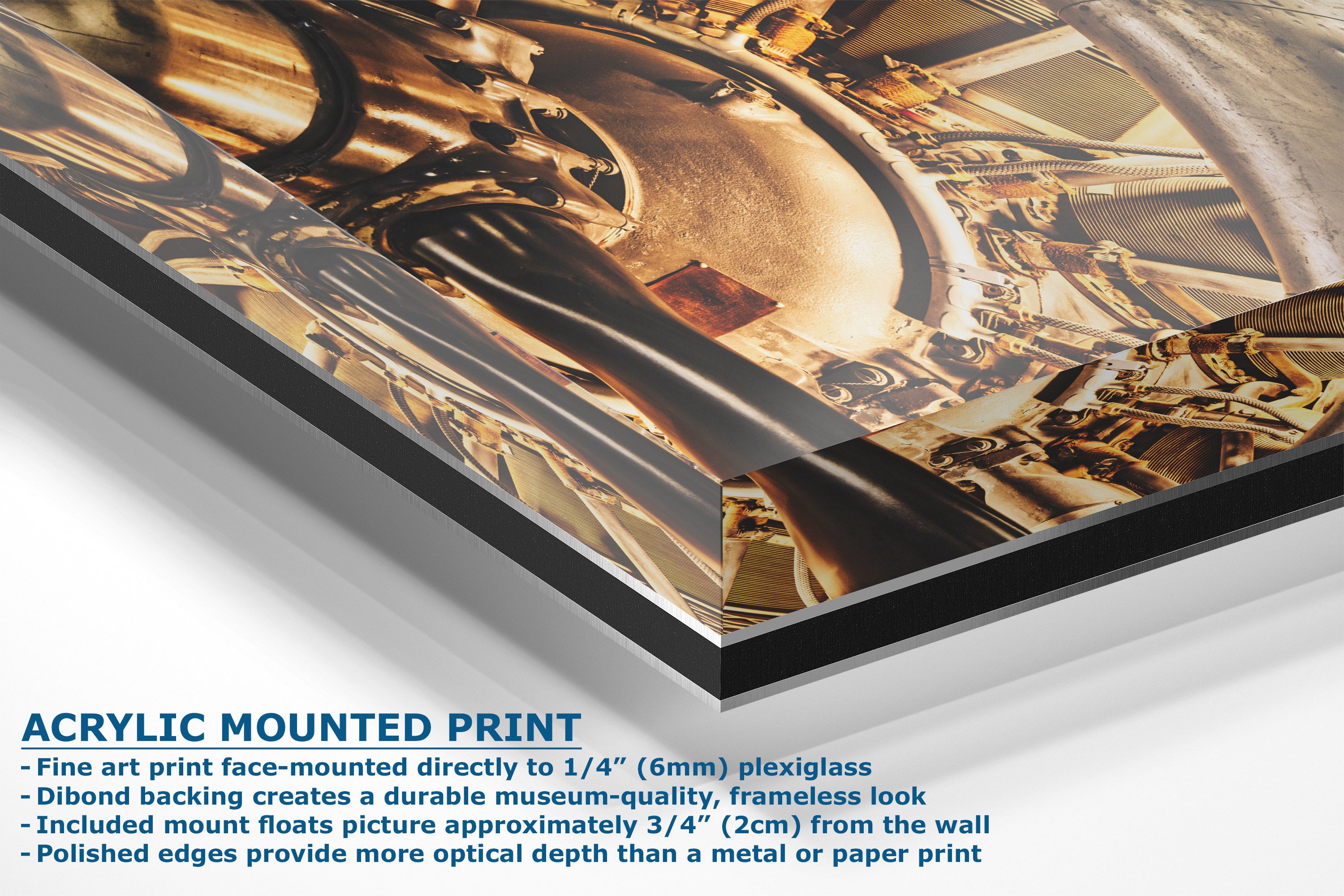 A corner view of an acrylic-mounted art print featuring a close-up photograph of golden-brown mechanical gears, with descriptive text on the bottom left detailing the mounting features.