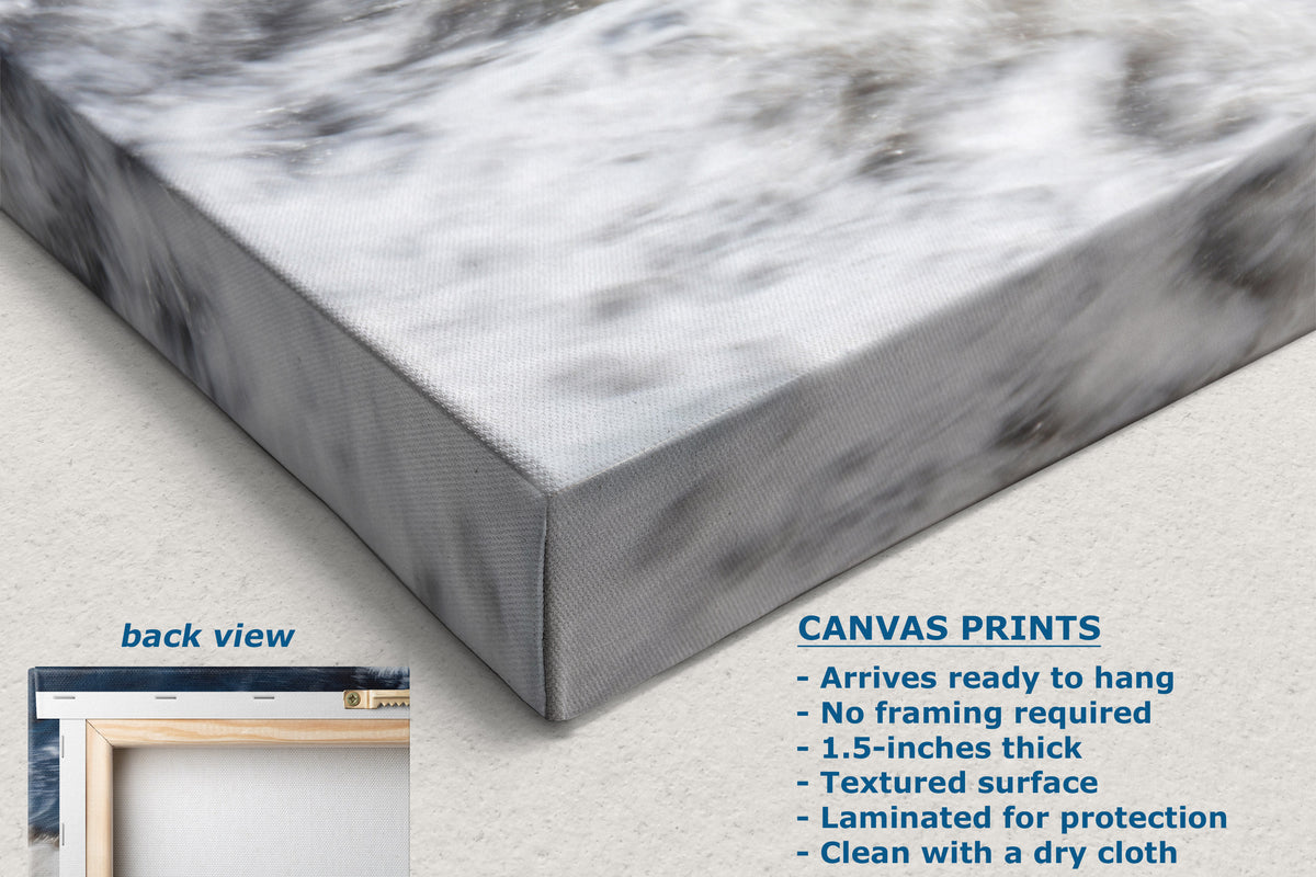 A close-up of a canvas wall art print showing the front and side of a rectangular canvas with a gray and white marble pattern. Text on the image describes the canvas print features, and a small inset shows the back view with a frame.