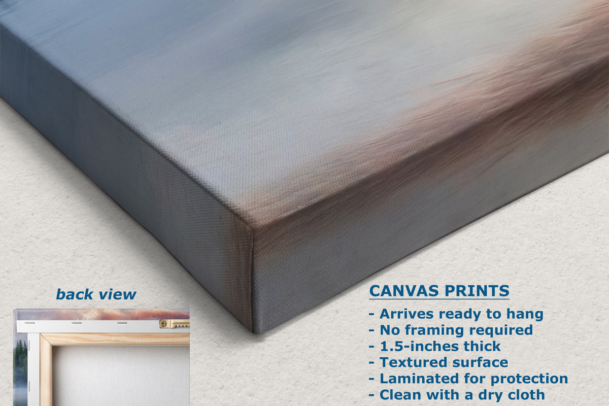 A corner view of canvas print product shown at an angle with a painted abstract scene in blue, gray, and brown tones. Text on the image describes the canvas print features, and a small inset shows the back view with a frame.