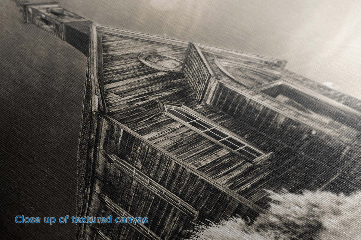 A close-up view to show detail and textured view of a canvas wall art print that shows a weathered wooden structure, likely a boat deck or hull, shown in a monochrome sepia-toned photograph with a blue text overlay reading 'Close up of textured canvas' in the lower-left corner.