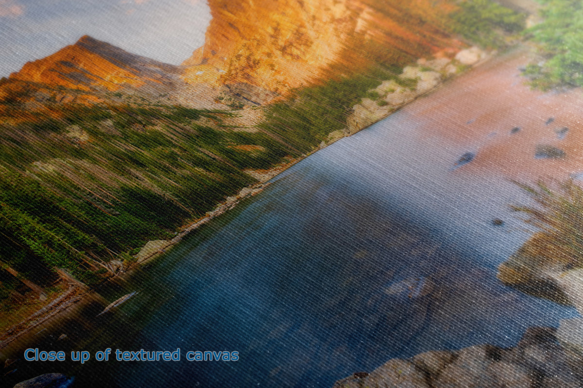 A close-up view of the texture of a canvas wall art print depicting a scenic landscape with text that says "close up of textured canvas.