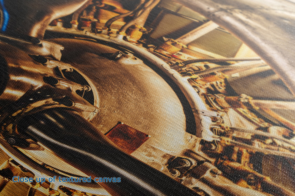 Close-up of the detail and texture of a canvas wall art print of a mechanical engine with intricate details.