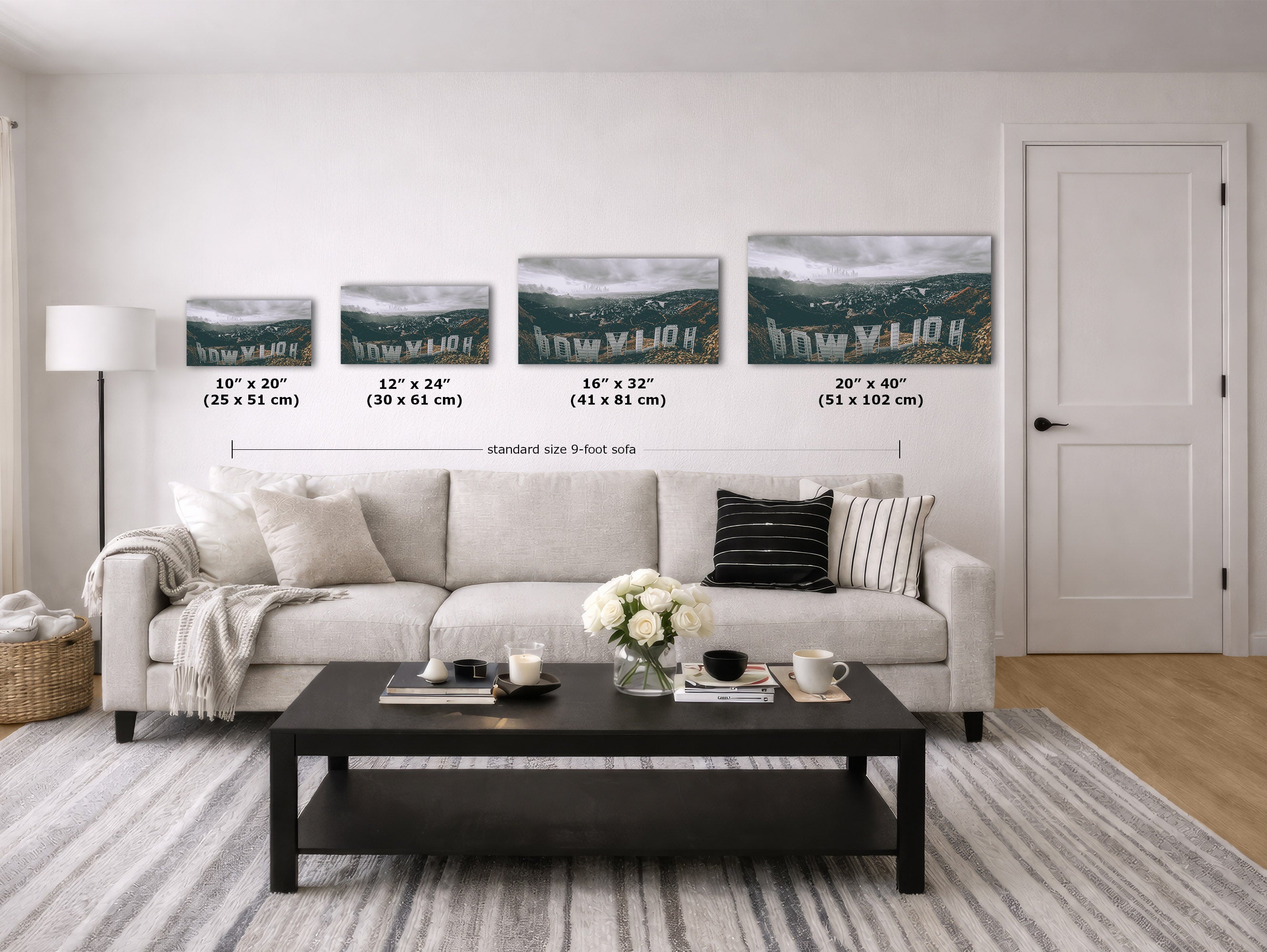 A staged living room showing four wall art prints above a sofa, with size labels and measurements for each print. Because a real interior environment is present, this is classified as Lifestyle rather than a Measurement Chart, even though dimensions are overlaid.