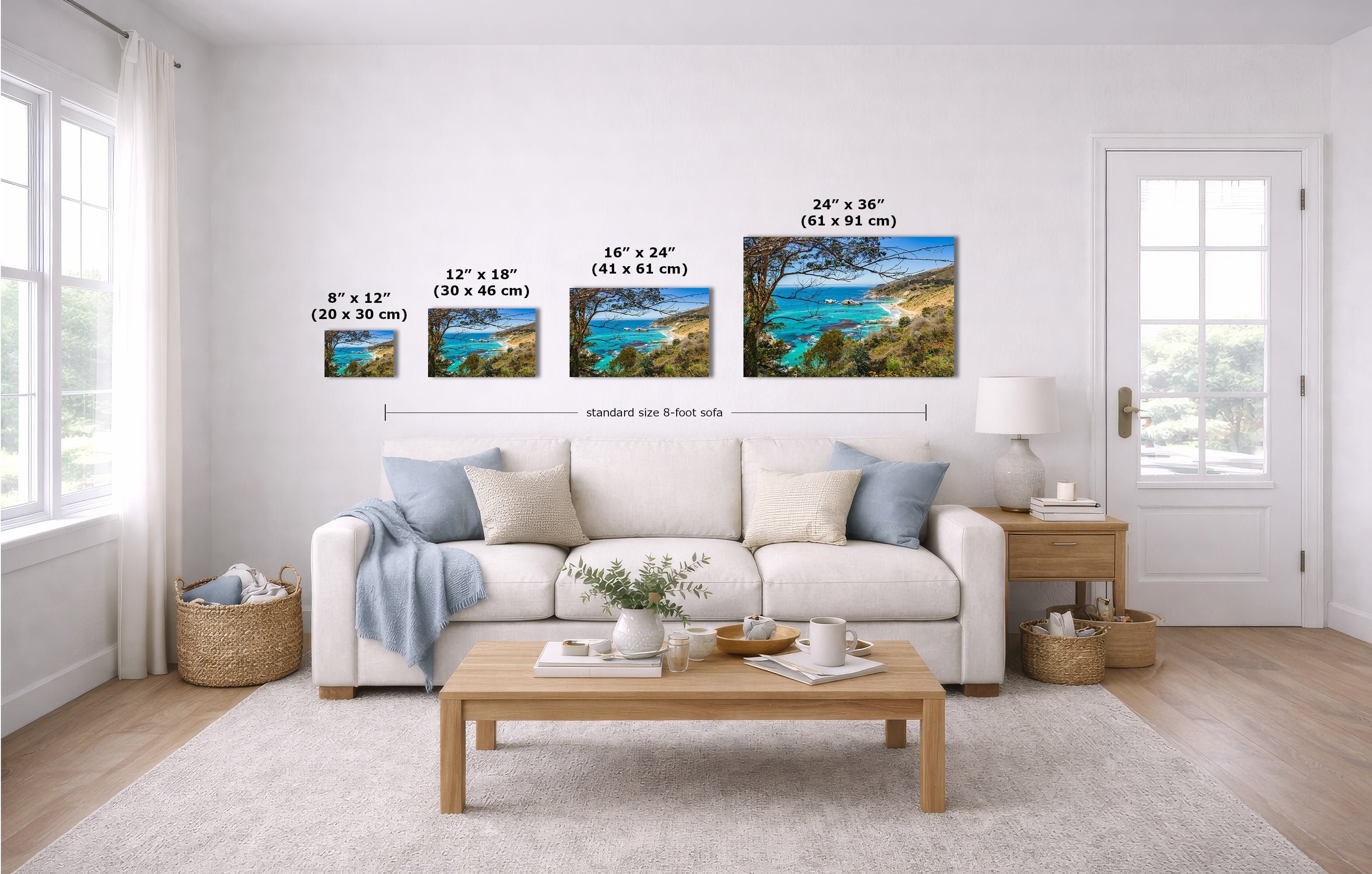 A staged living room shows a set of four wall art prints above a white sofa, with size labels overlaid for each print. The prints depict blue water scenes with sandy shores.