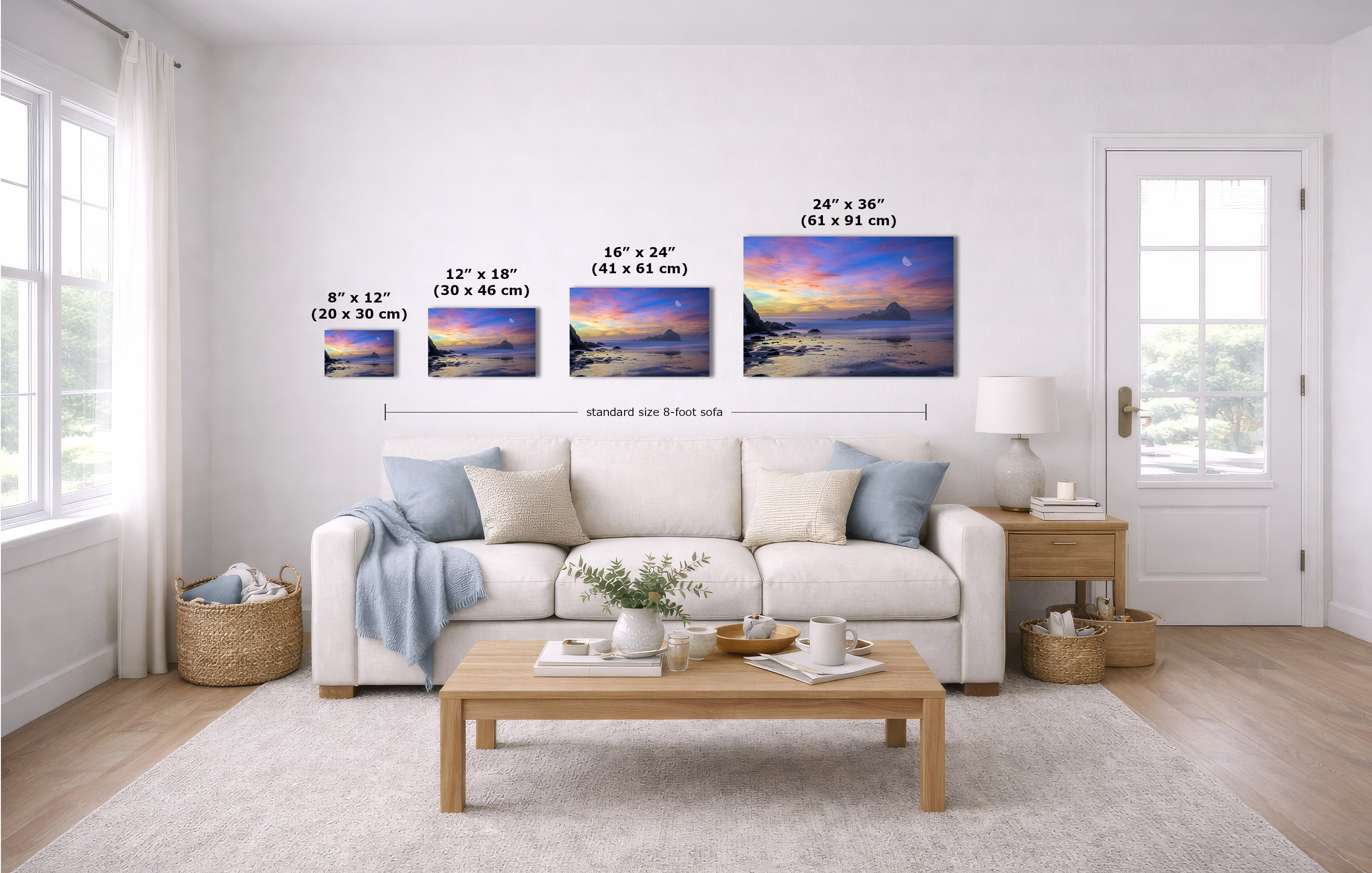 A staged living room shows four wall art prints above a white sofa, each with size text labels. The prints depict colorful sunset or sunrise lake or ocean scenes.