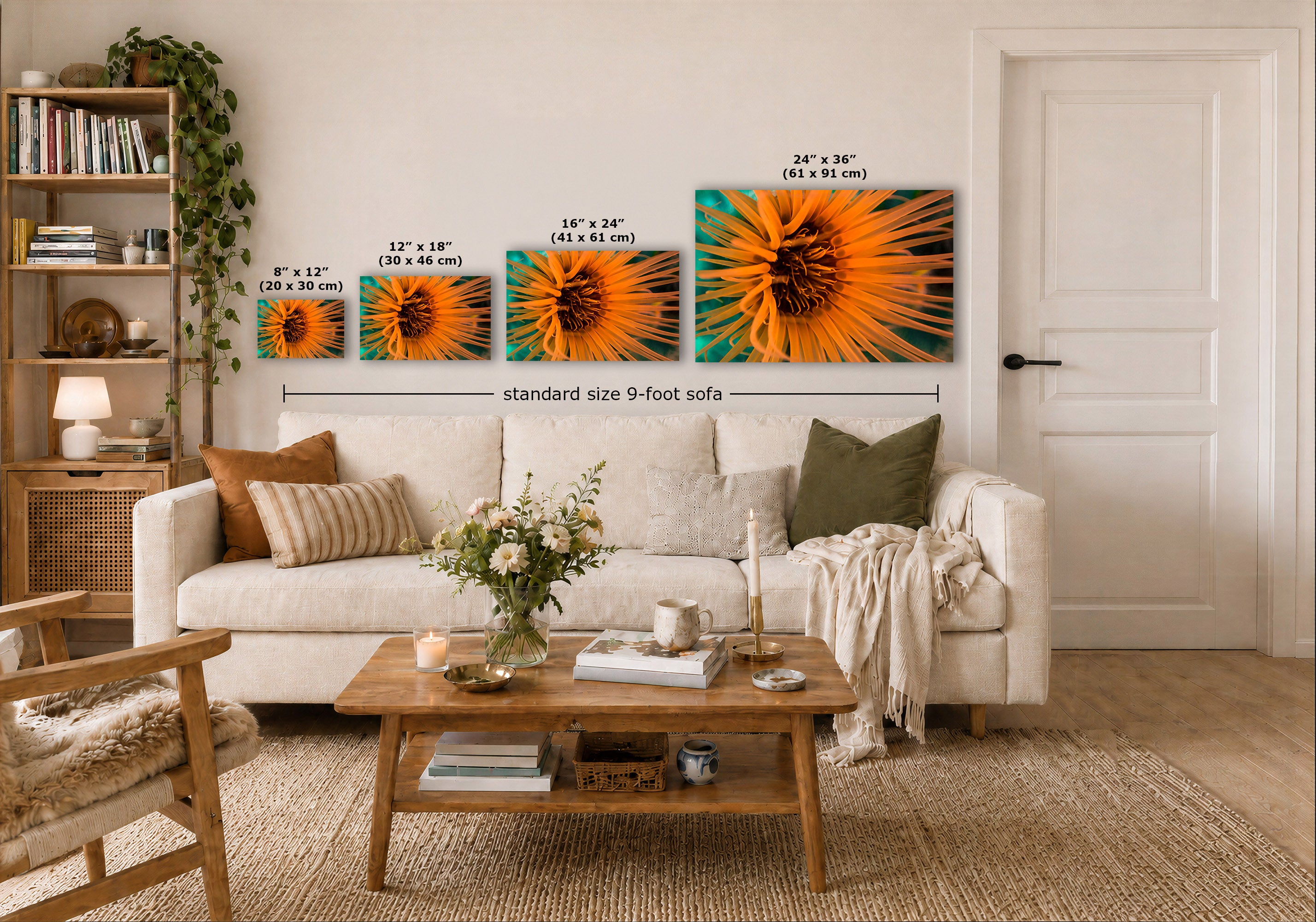 Three anemone wall art prints displayed above a white sofa in a bright living room and size labels are overlaid on each piece plus a 'standard size 9-foot sofa' measurement line across the set.