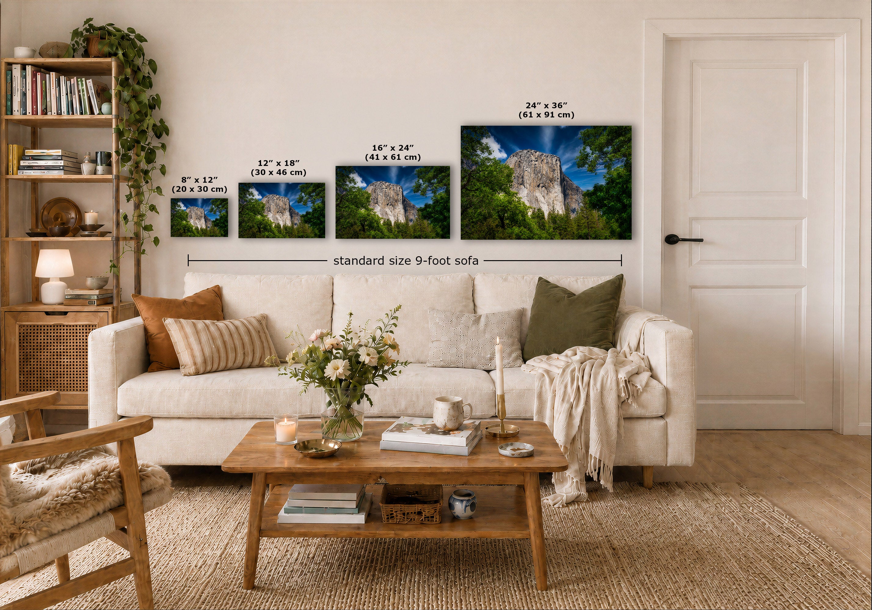A styled living room showing four landscape prints, with size labels and a dimension line indicating standard 9-foot sofa spacing. The room includes a white sofa, wooden coffee table, shelving, and a white door.