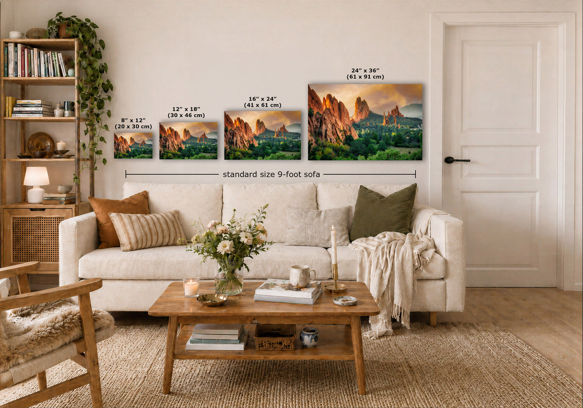 A staged living room shows a white sofa, wooden coffee table, shelving, and a large wall display of four framed landscape prints with printed size labels and a 'standard size 9-foot sofa' measurement callout.