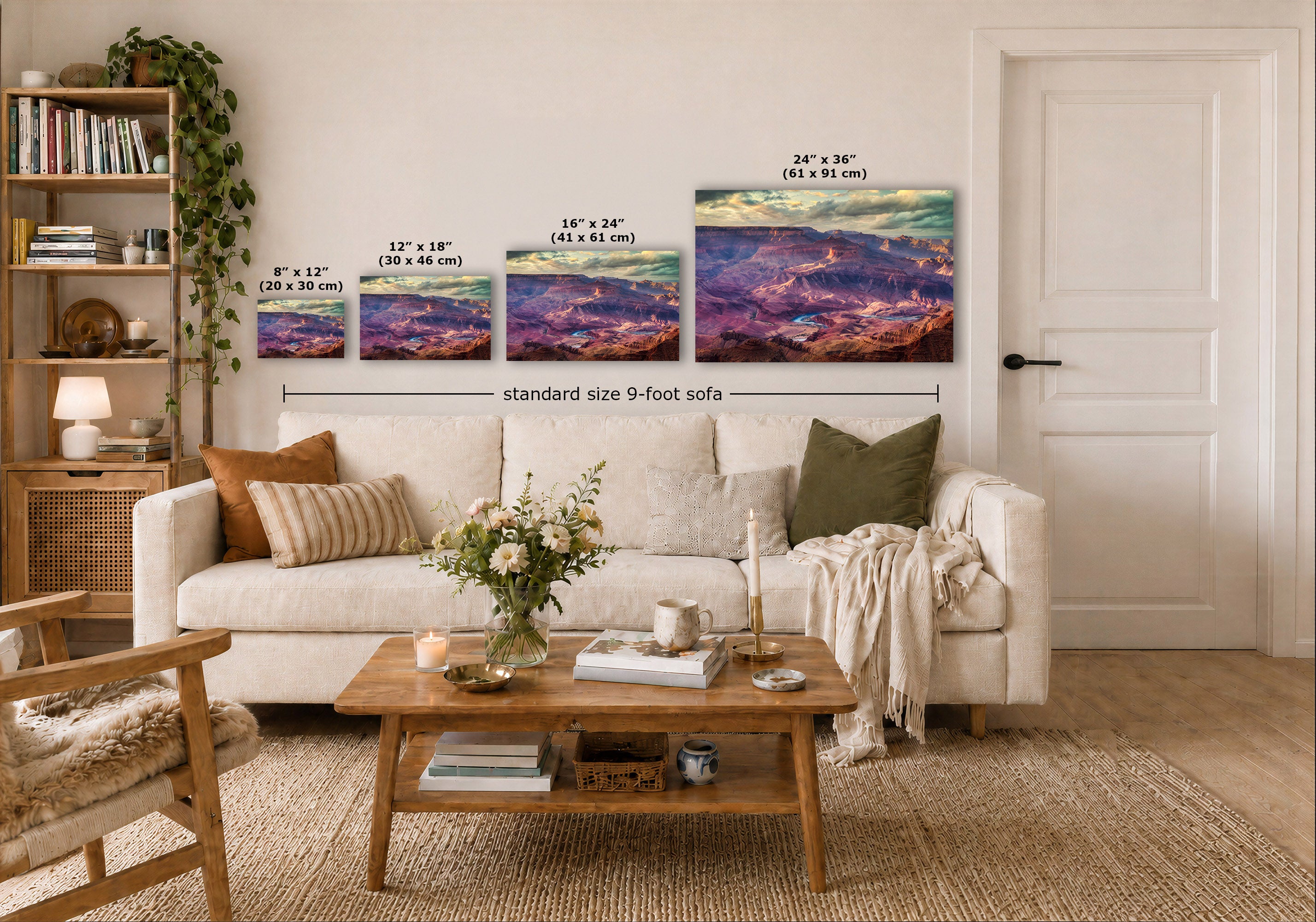 A staged living room showing four wall art prints above a white sofa, with size labels overlaid for each print. The artwork depicts colorful mountain or canyon landscapes in purple, blue, pink, and orange tones.