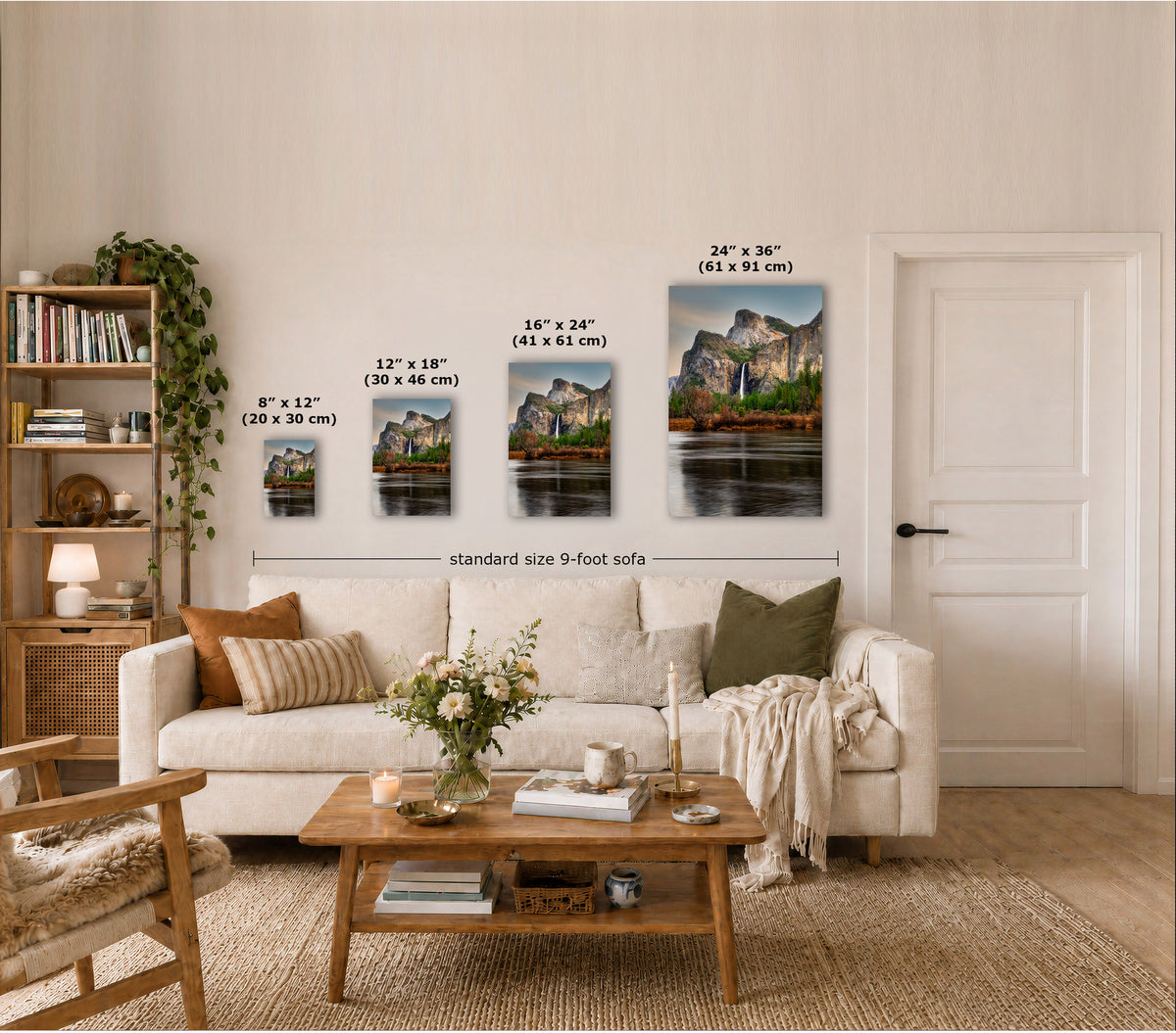 A staged living room shows four vertical wall art prints of a mountain landscape in different sizes above a sofa, with printed dimensions overlaid on each piece. Because a real interior environment is clearly present, this is Lifestyle rather than Product/Packaging.