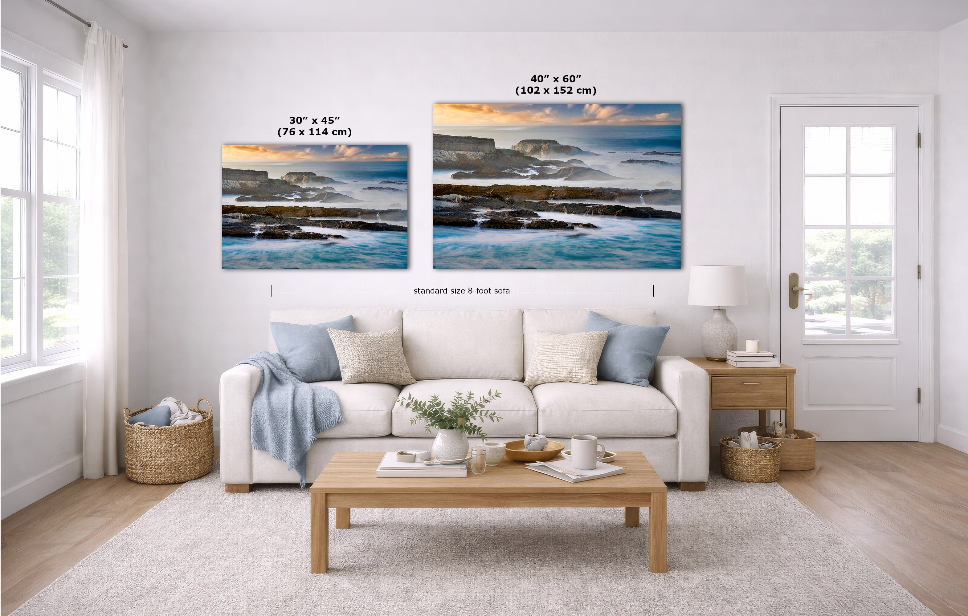 A staged living room with a white sofa, coffee table, and wall art. Two coastal landscape canvas prints hang above the couch, with size labels and a dimension line indicating standard size 8 feet side.