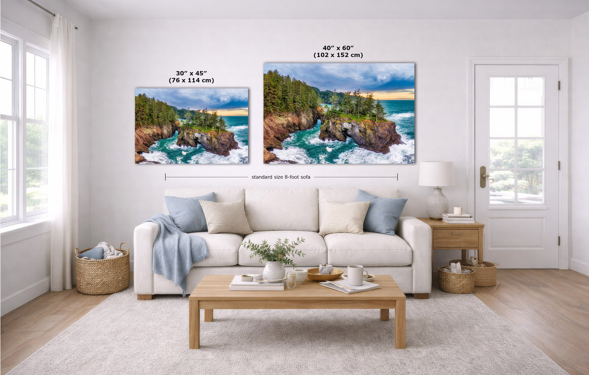 A staged living room shows two coastal landscape wall art prints above a white sofa. The left print is labeled 30 x 45 inches, and the right print is labeled 40 x 60 inches.