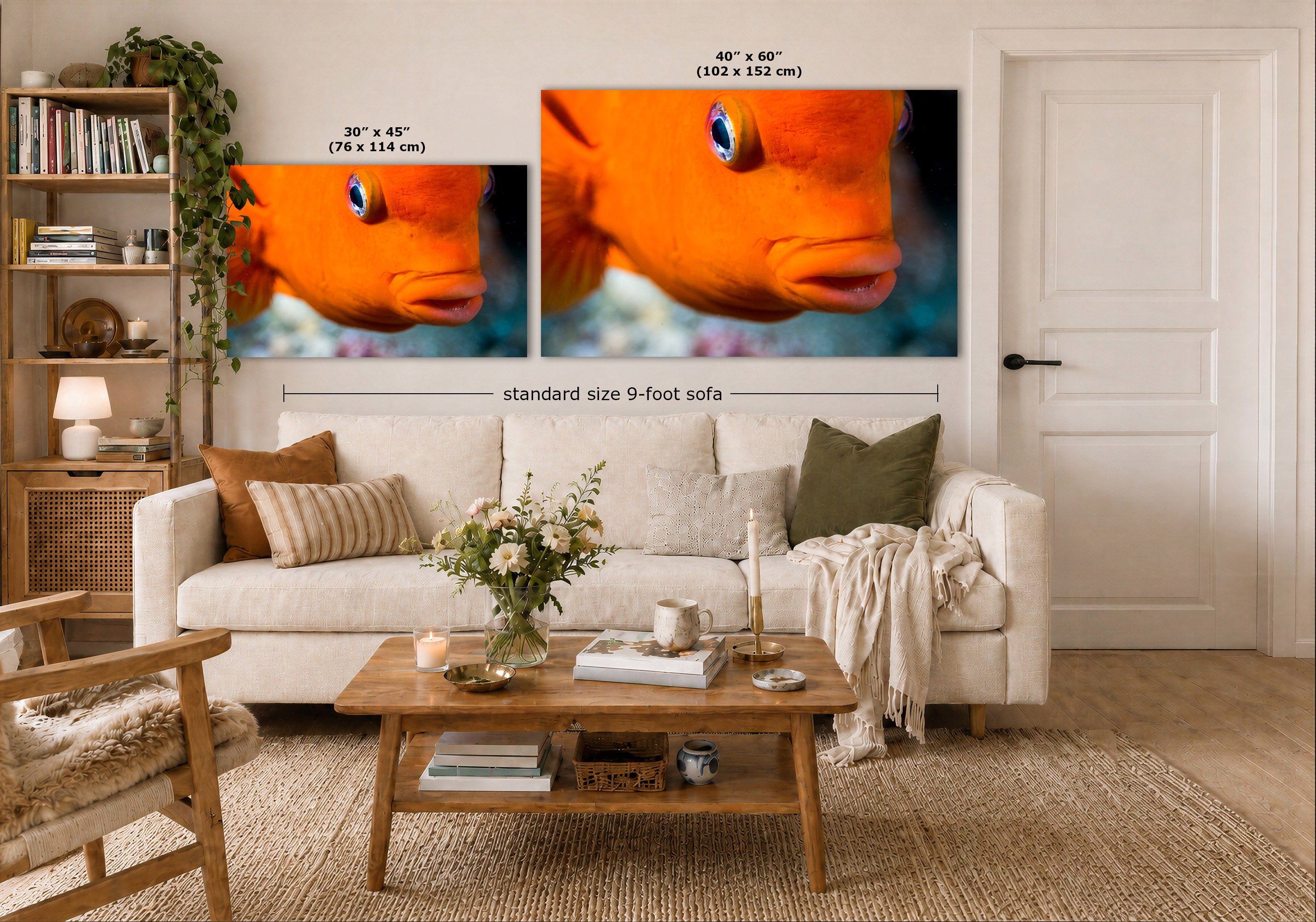 Two orange fish wall art prints displayed above a white sofa in a styled living room. The left print is labeled 30 x 45 inches (standard size 9-foot sofa), and the right print is labeled 40 x 60 inches.