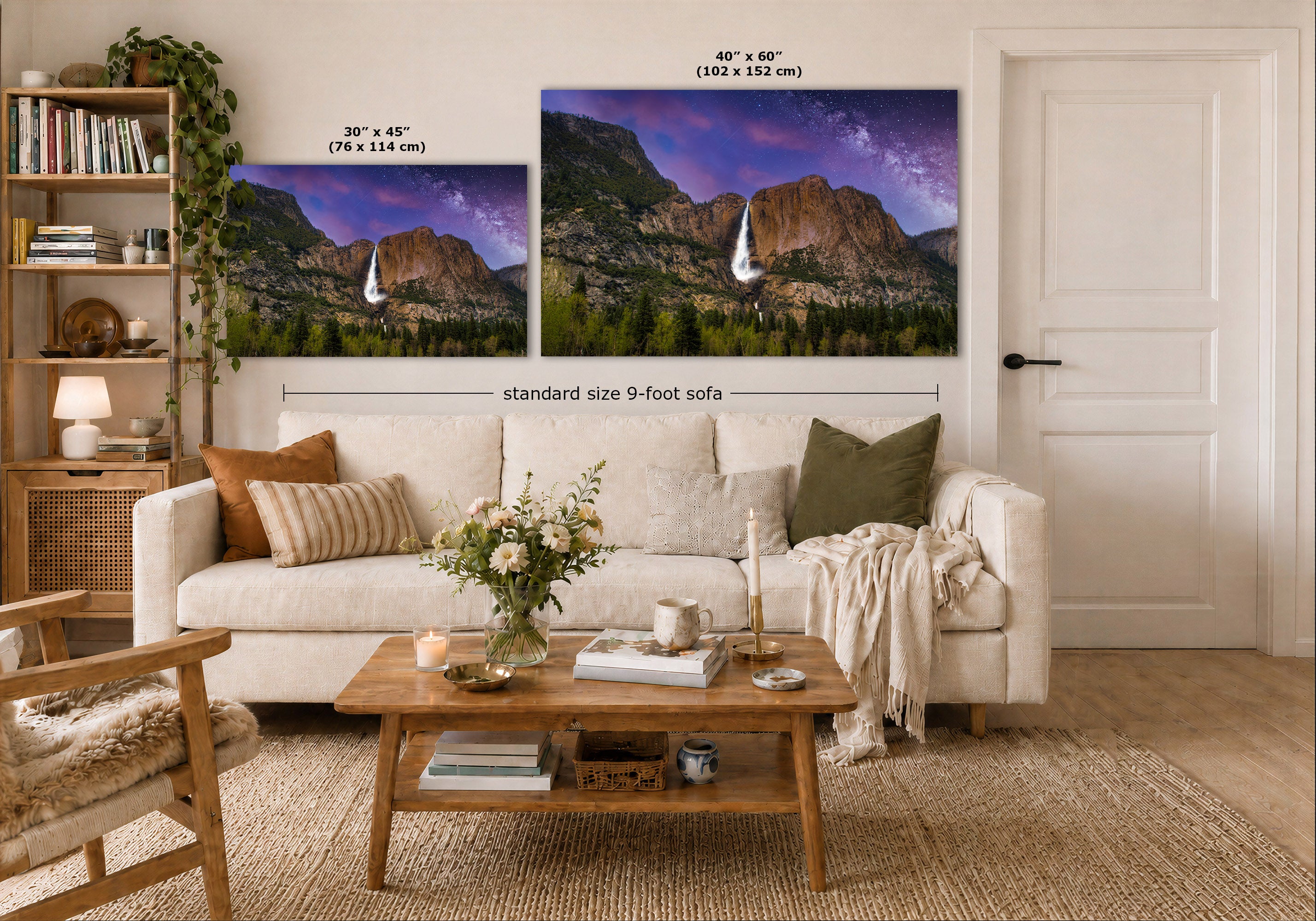 A styled living room showing two landscape wall art prints above a white sofa. The prints depict a mountain scene at dusk with a waterfall under a purple sky.