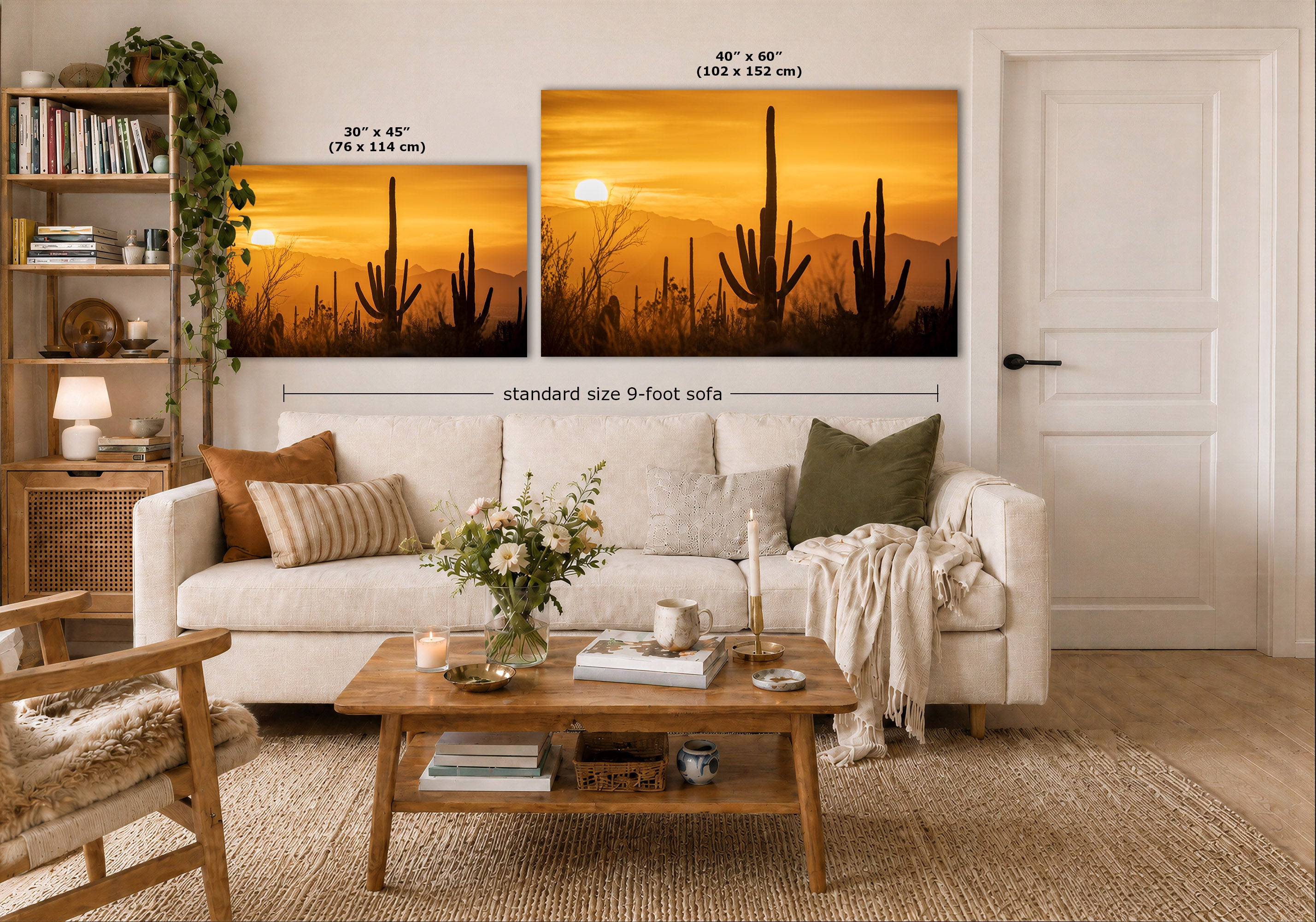A styled living room showing two desert sunset wall art prints above a white sofa. The left print is labeled 30 x 45 inches, and the larger right print is labeled 40 x 60 inches, with a note for a standard size 9-foot sofa.