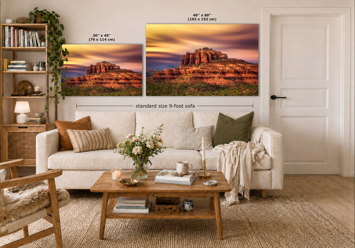 A styled living room showing two desert landscape wall art prints above a white sofa, with size callouts reading 30 x 45 inches and 40 x 60 inches plus a note for a standard size 9-foot sofa.