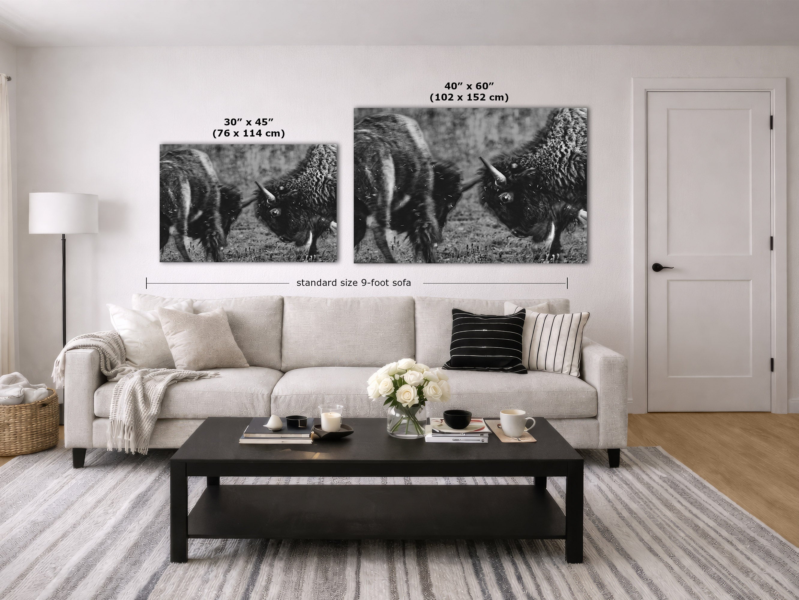 A staged living room showing two black-and-white buffalo wall art prints above a light sofa, with dimension labels indicating 30 x 45 inches and 40 x 60 inches. The room includes a coffee table, lamp, door, and rug.