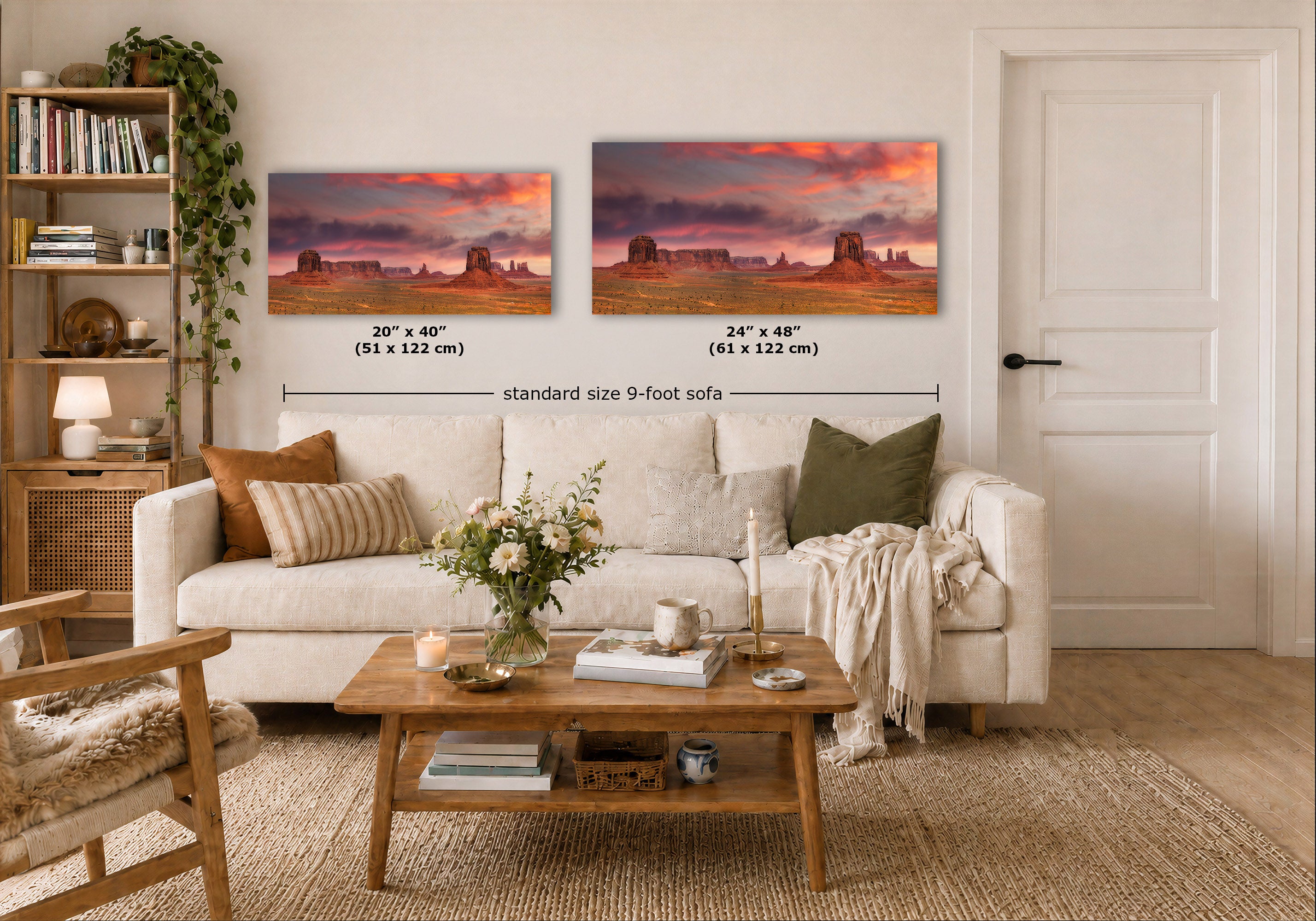 Two wall art prints showing a desert landscape with rock formations under a dramatic pink and purple sky, displayed above a white sofa in a styled living room. Black dimension lines and text indicate the sizes: 20 x 40 inches (51 x 122 cm) and 24 x 40 inches (61 x 122 cm), with 'standard size 9-foot sofa' written below.