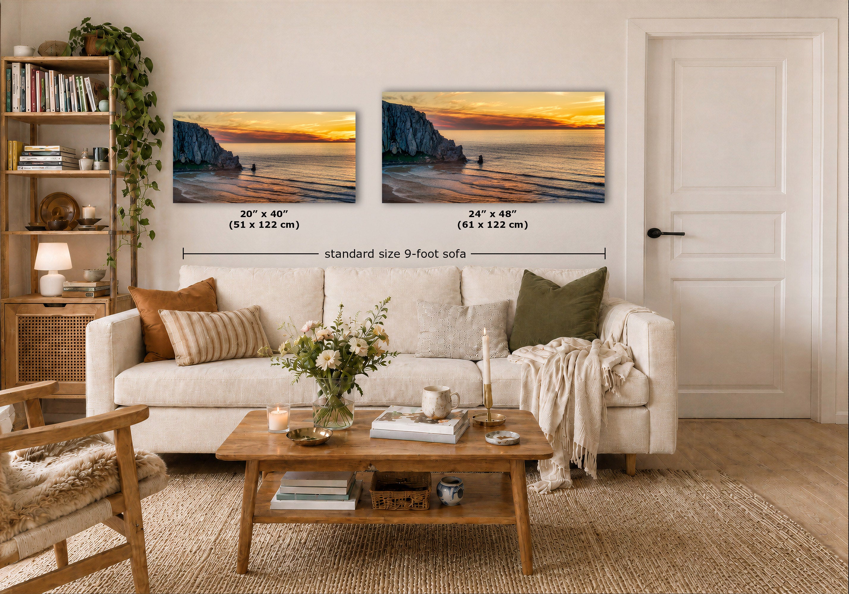 Two wall art prints showing a coastal sunset scene are displayed above a white sofa in a styled living room. Black dimension lines and text indicate the sizes of each print: 20 x 40 inches (51 x 122 cm) and 24 x 48 inches (61 x 122 cm), with a note for a standard size 9-foot sofa.