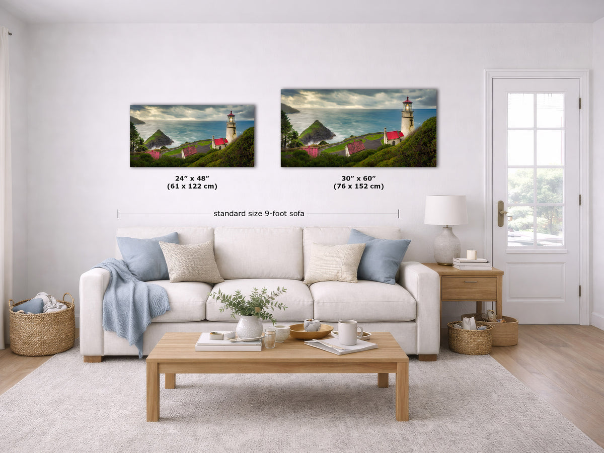 Two framed coastal landscape wall art prints are shown above a white sofa in a bright living room. The left print reads 24 x 48 inches (61 x 122 cm) and the right print reads 30 x 60 inches (76 x 152 cm), with a label below indicating standard size 9-foot sofa spacing.