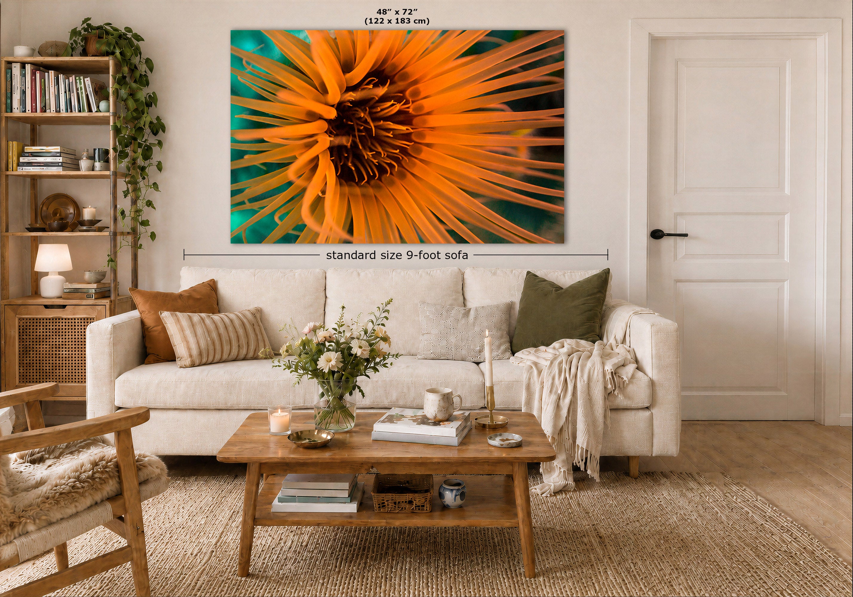 A wall art print displayed above a white sofa in a styled living room. Measurement text and arrows indicate the print size as 48 x 72 inches (122 x 183 cm) and note a standard 9-foot sofa below.