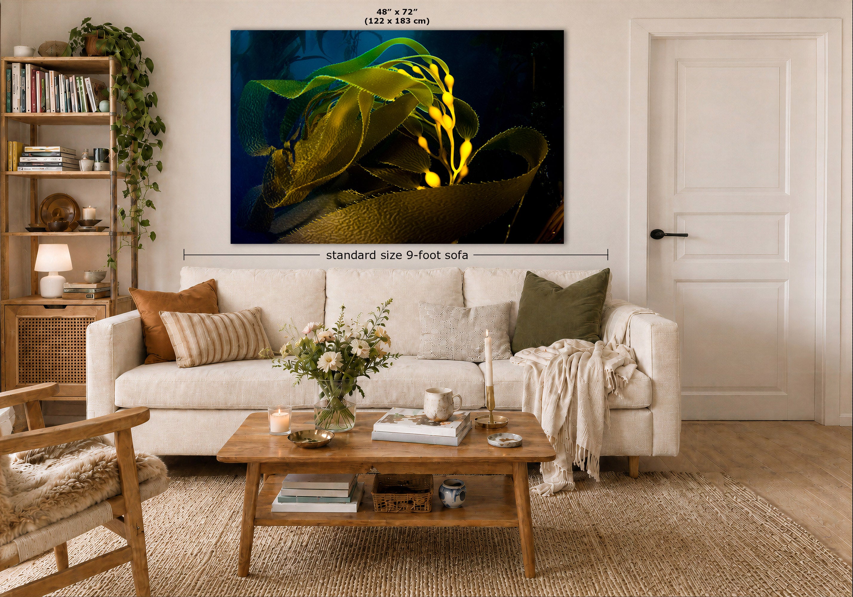 A large wall art print showing a dark underwater scene with bright yellow-green seaweed is displayed above a white sofa in a styled living room. Measurement labels indicate the print is 48 x 72 inches, and a dimension callout notes standard size 9-foot sofa height.
