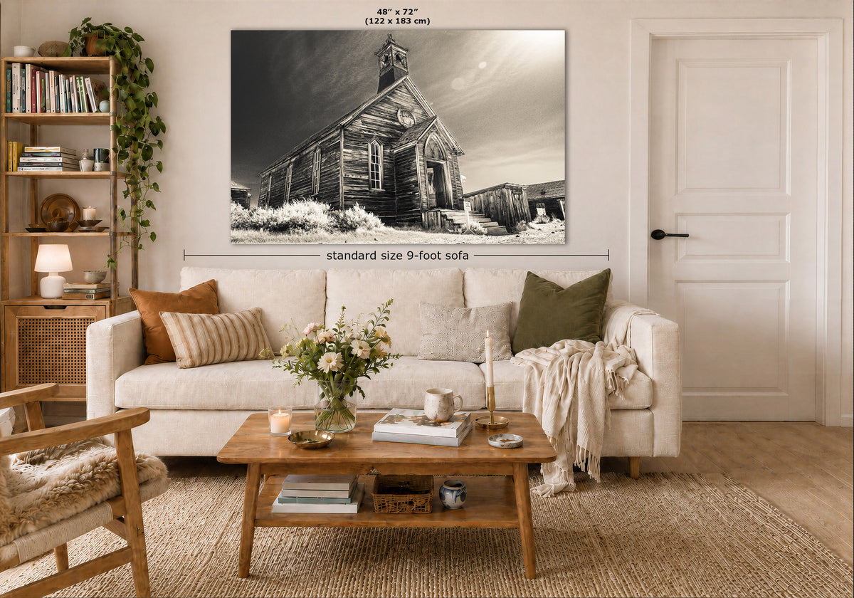 A large vintage wall art print of a rustic old wooden church building is displayed in a styled living room mockup above a white sofa. The image includes dimension markings indicating the print is 48 x 72 inches (122 x 183 cm) and features a 'standard size 9-foot sofa' width reference.