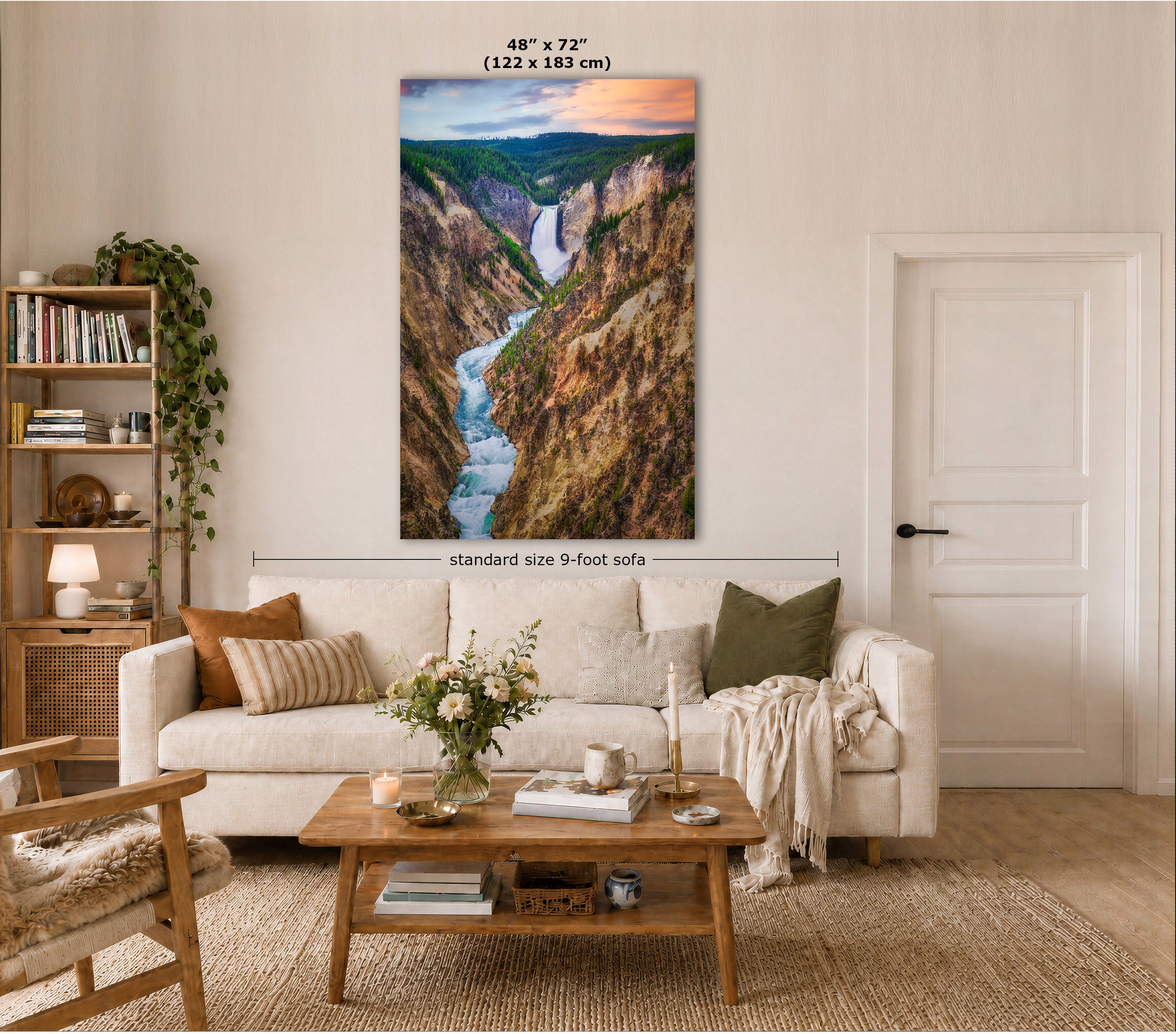 A large vertical canvas print of a scenic canyon landscape with a waterfall is displayed on a wall in a styled living room. The image includes size annotations indicating the print is 48" x 72" (122 x 183 cm) and notes a standard 9-foot sofa width for scale.