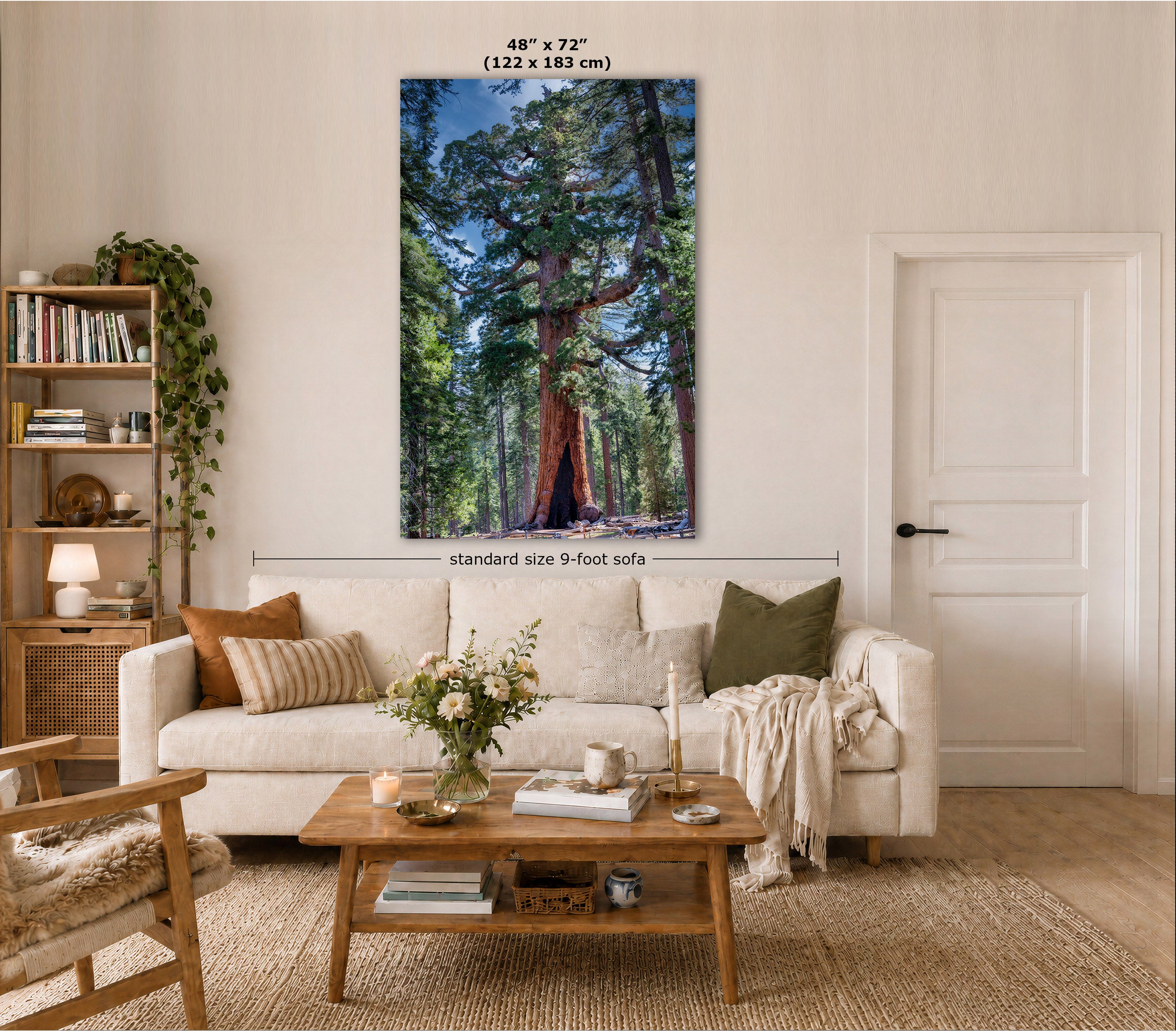 A large vertical wall art print showing a forest scene with tall trees and blue sky, displayed above a white sofa in a styled living room. Text at the top reads 48 in x 72 in (122 x 183 cm), and a measurement line indicates standard size 9-foot sofa.