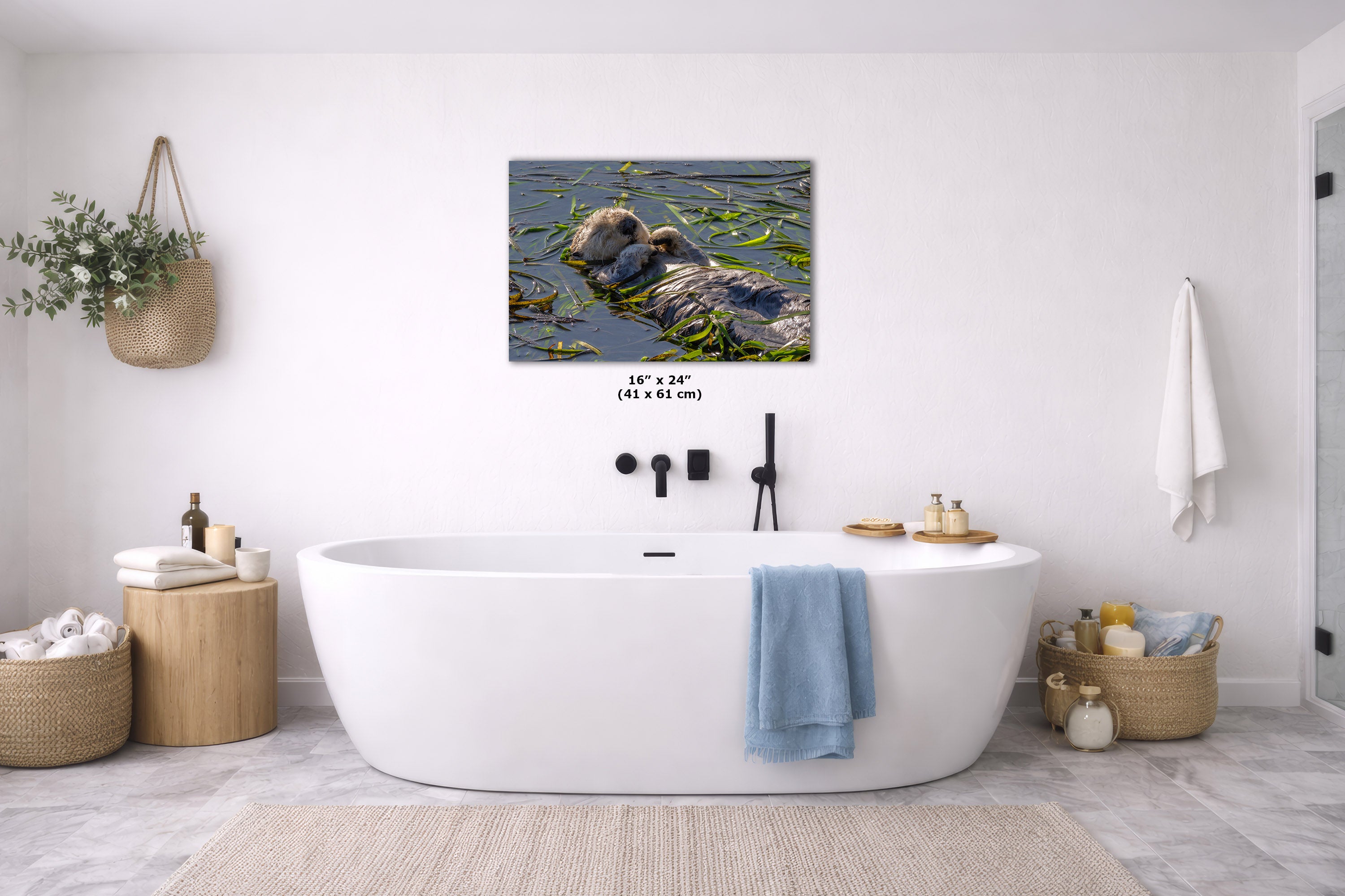 A wall art print, displayed above a white freestanding bathtub in a bright, modern bathroom. The print includes size text reading 16 x 24" (41 x 61 cm).