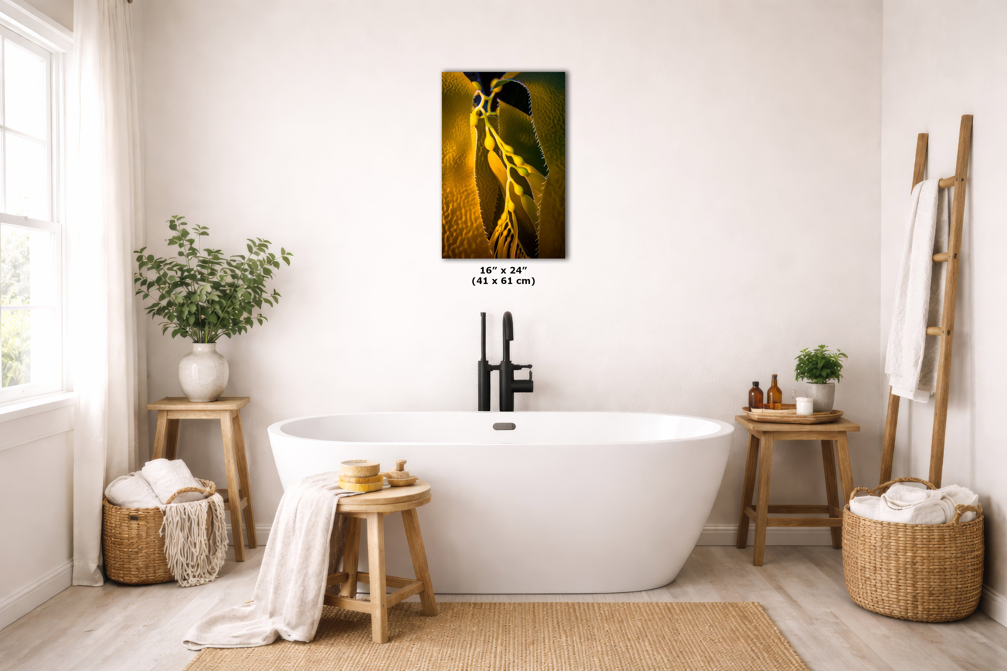 A framed wall art print showing a close-up of an underwater scene hanging from a dark branch, displayed above a white freestanding bathtub in a bright, neutral-toned bathroom with plants, woven baskets, and wooden stools.