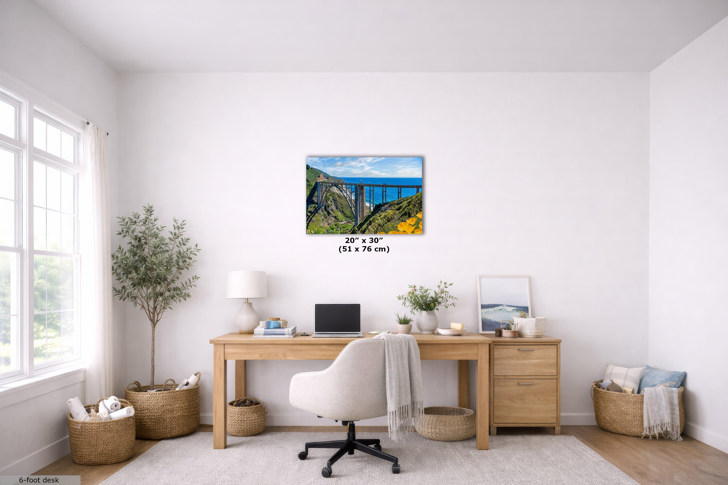 Home office with a desk, chair, and wall art displaying a bridge.