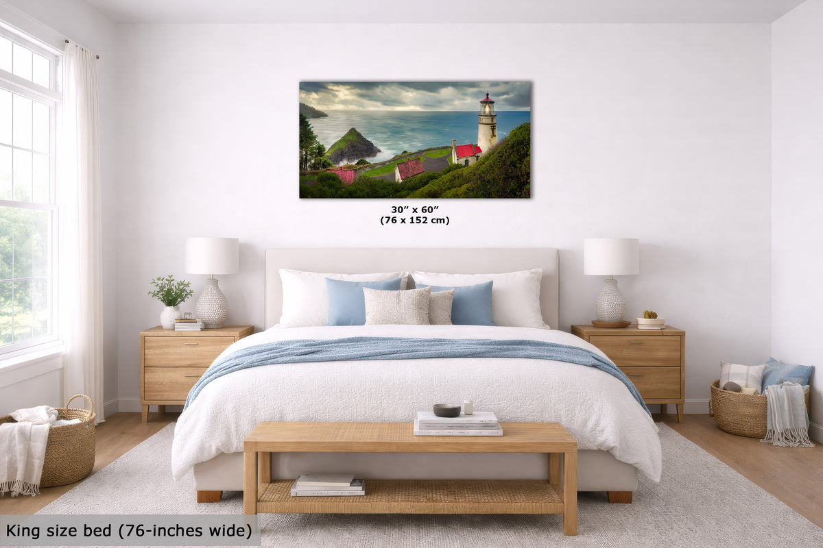 A framed wall art print showing a coastal lighthouse scene with green hills, red-roofed buildings, and a cloudy sky, displayed above a bed in a bright bedroom. Text indicates the print is 30" x 60" (76 x 152 cm) and the bed is king size 76-inches wide.