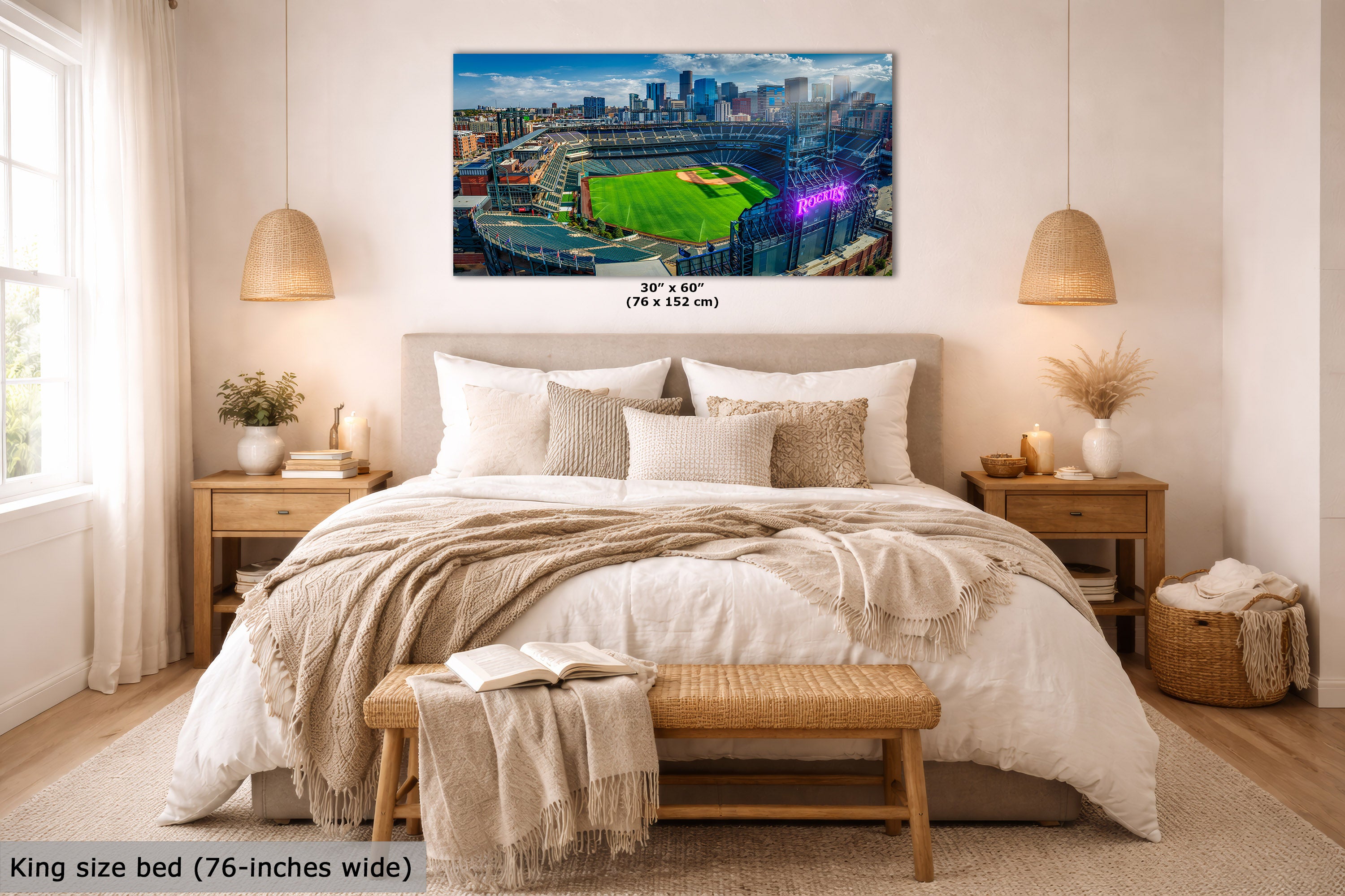 A wall art print showing a baseball stadium scene is displayed above a neatly made bed in a bright, modern bedroom. The print includes size text reading 30 x 60 in (76 x 152 cm), and the room scene includes a text overlay noting the king size bed is 76-inches wide.