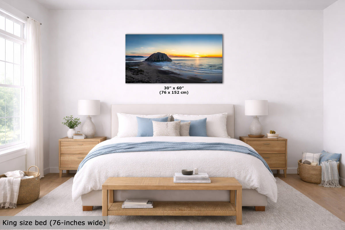 A wall art print showing a beach sunset scene is displayed above a neatly made bed in a bright, modern bedroom. The print is labeled with dimensions '30" x 60" (76 x 152 cm)', and the image includes a text overlay at the bottom left stating 'King size bed (76-inches wide)'.