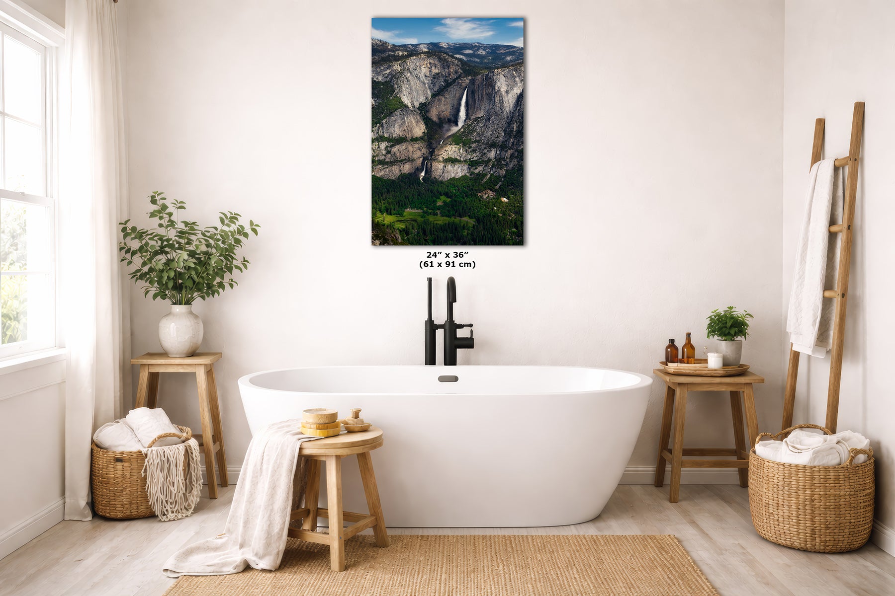 A vertical wall art print depicting a scenic waterfall in a mountain landscape, styled in a bright, modern bathroom above a freestanding bathtub. The print is shown with its dimensions overlaid in the center.