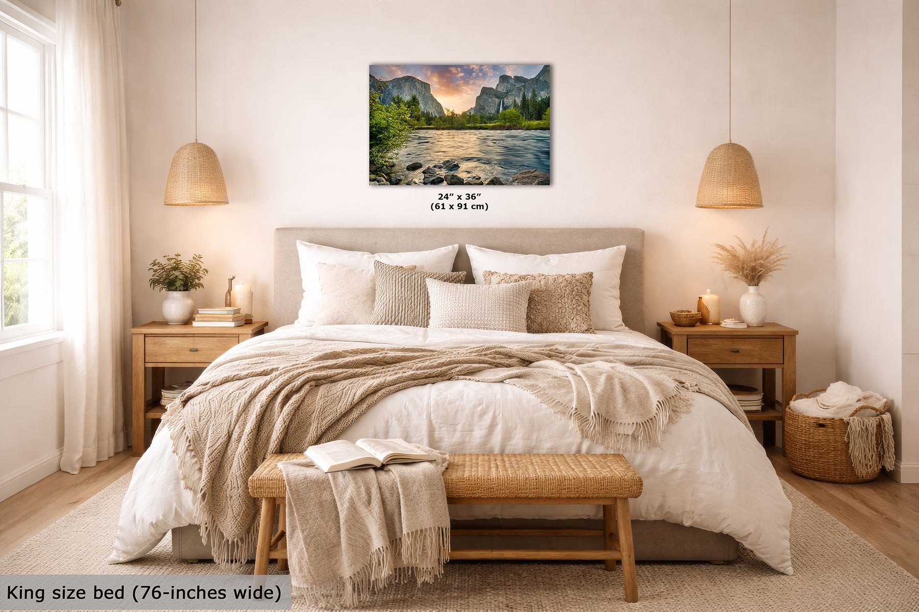 A Yosemite wall art print depicting El Capitan mountain and Merced River landscape at sunrise is displayed above a neatly made bed in a bright, modern bedroom. The print includes size text reading 24 x 36 inches (61 x 91 cm), and the image also shows a text label at the bottom left stating King size bed (76-inches wide).