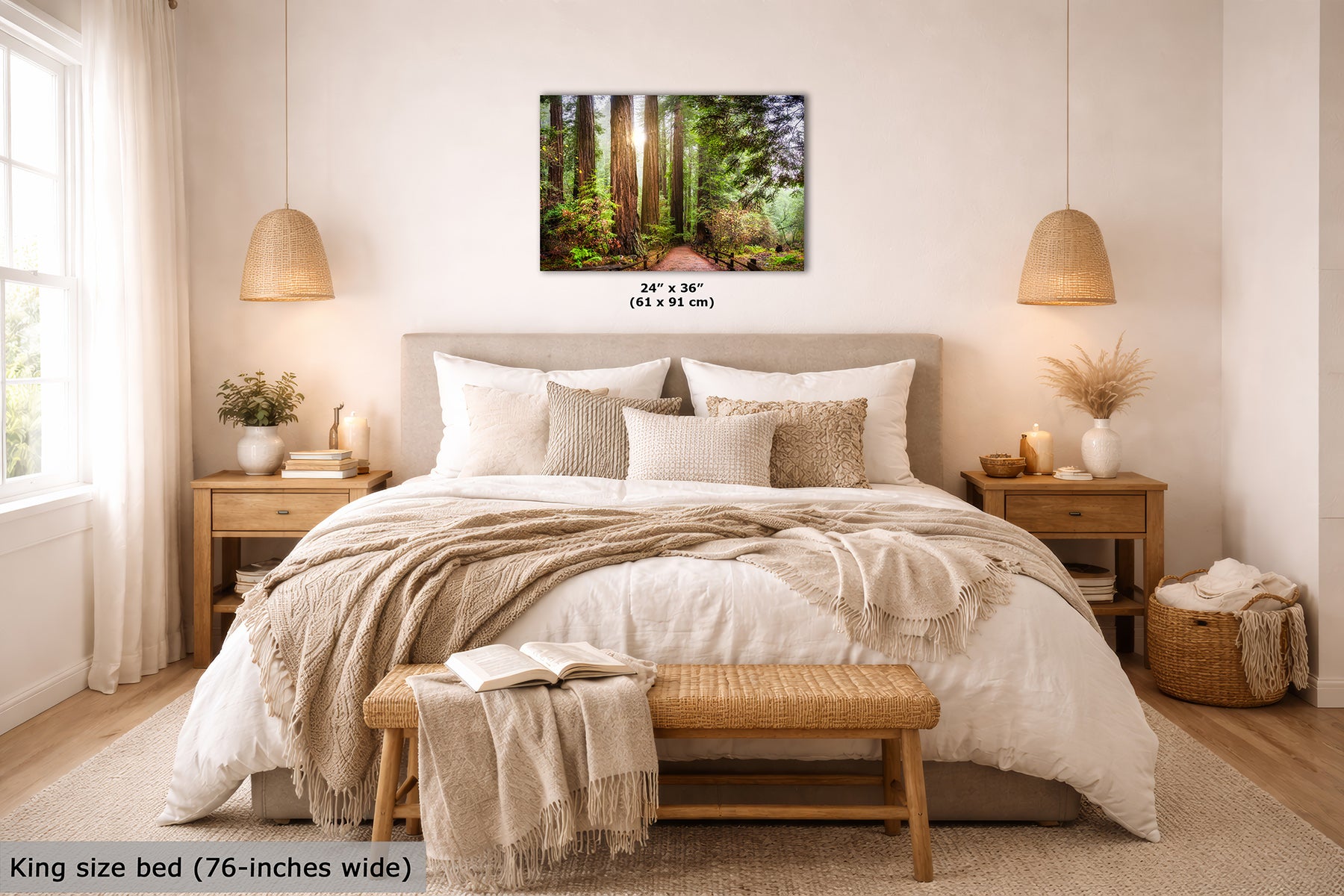 A California Redwood forest wall art print hangs above a neatly made bed in a bright, modern bedroom. The print shows a sunlit woodland path with tall trees and green foliage.
