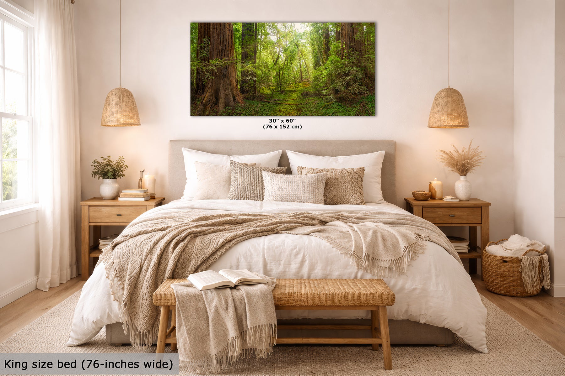 A Redwood forest wall art print displayed above a neatly made bed in a bright, modern bedroom. The print shows a lush green woodland scene with tall trees and sunlight filtering through the canopy.