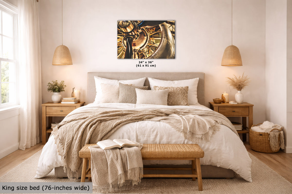 A wall art print with an abstract gold, black, and brown design is displayed above a neatly made bed in a warm, modern bedroom. The print includes size text indicating 24" x 36" (61 x 91 cm), and the image has a text overlay at the bottom left stating 'King size bed (76-inches wide)'.